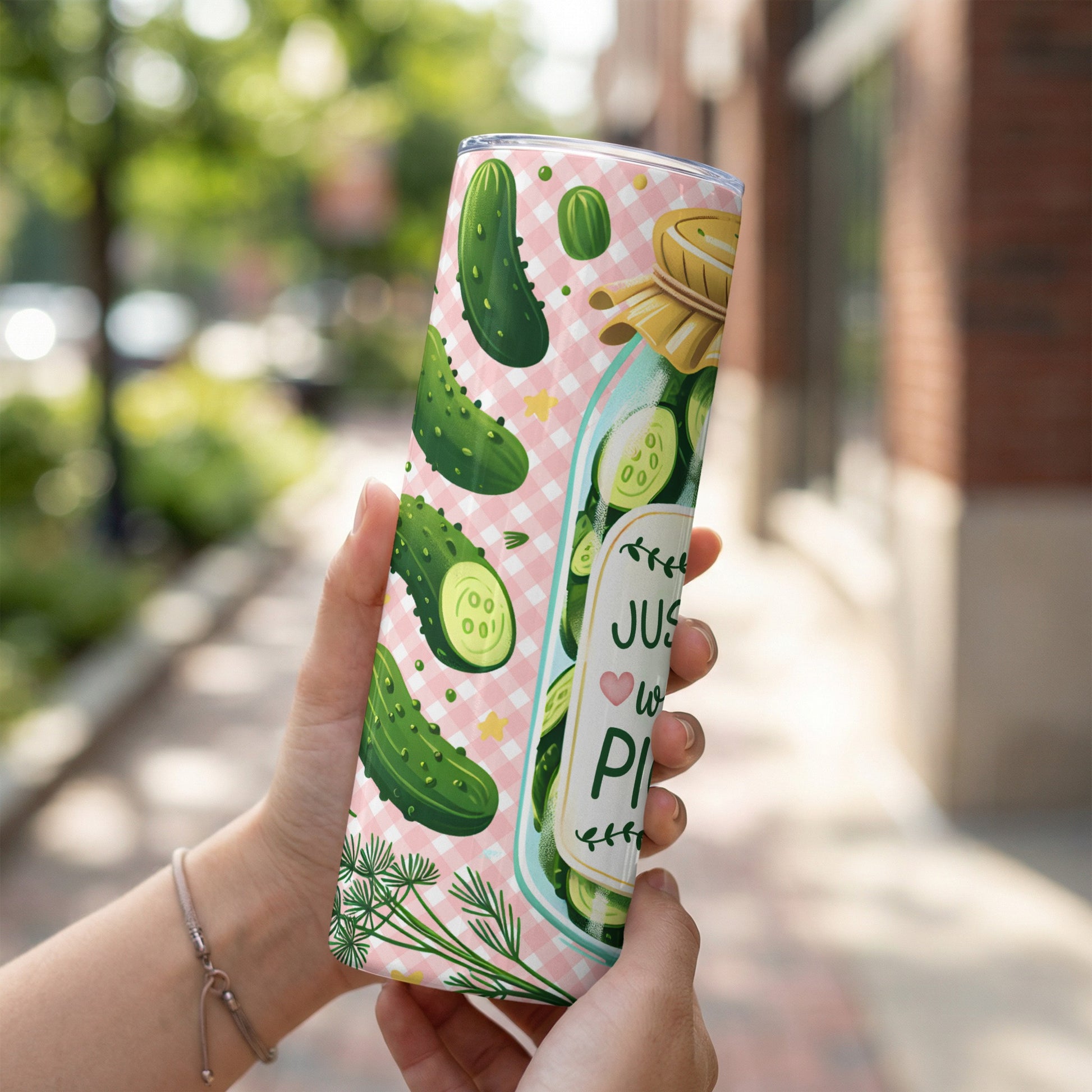 Pink checkered tumbler with green pickles and "Just a little bit in a pickle" text.