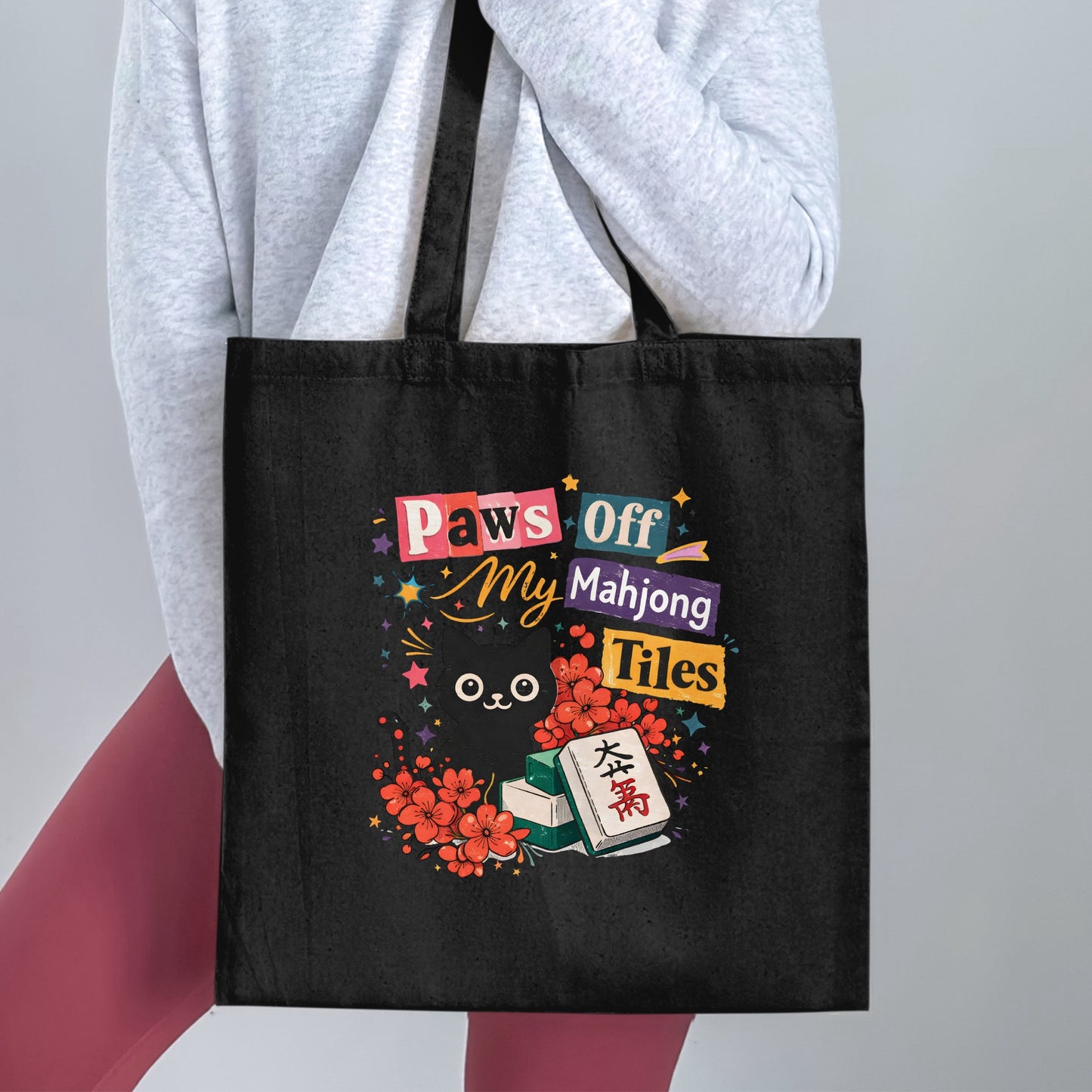 Black tote bag with "Paws Off My Mahjong Tiles" and a cat design.