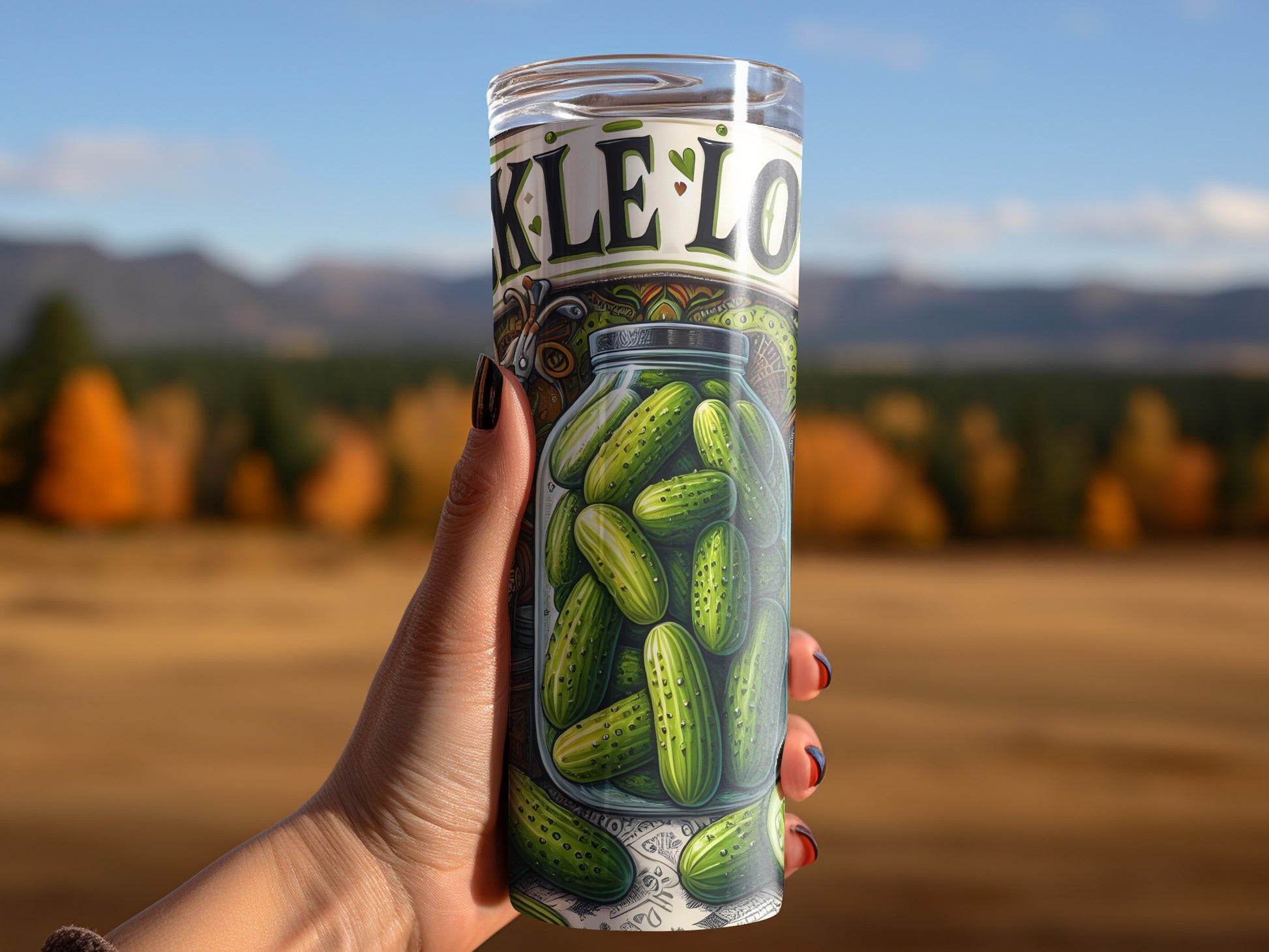 Glass tumbler with pickles and "Pickle Lover" text held by a hand.