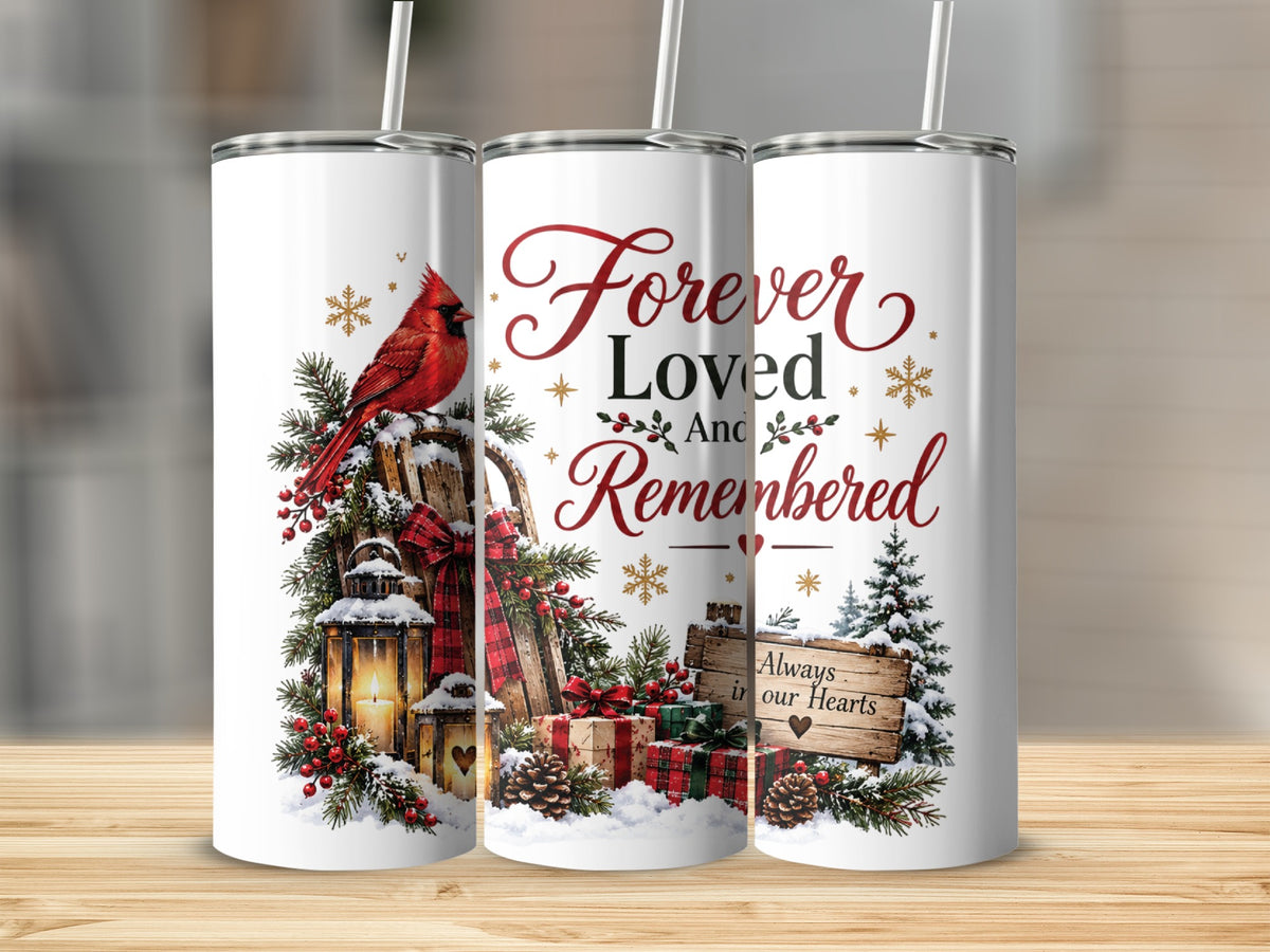 Three views of a white tumbler featuring a winter cardinal, lantern, and the memorial text Forever Loved And Remembered.