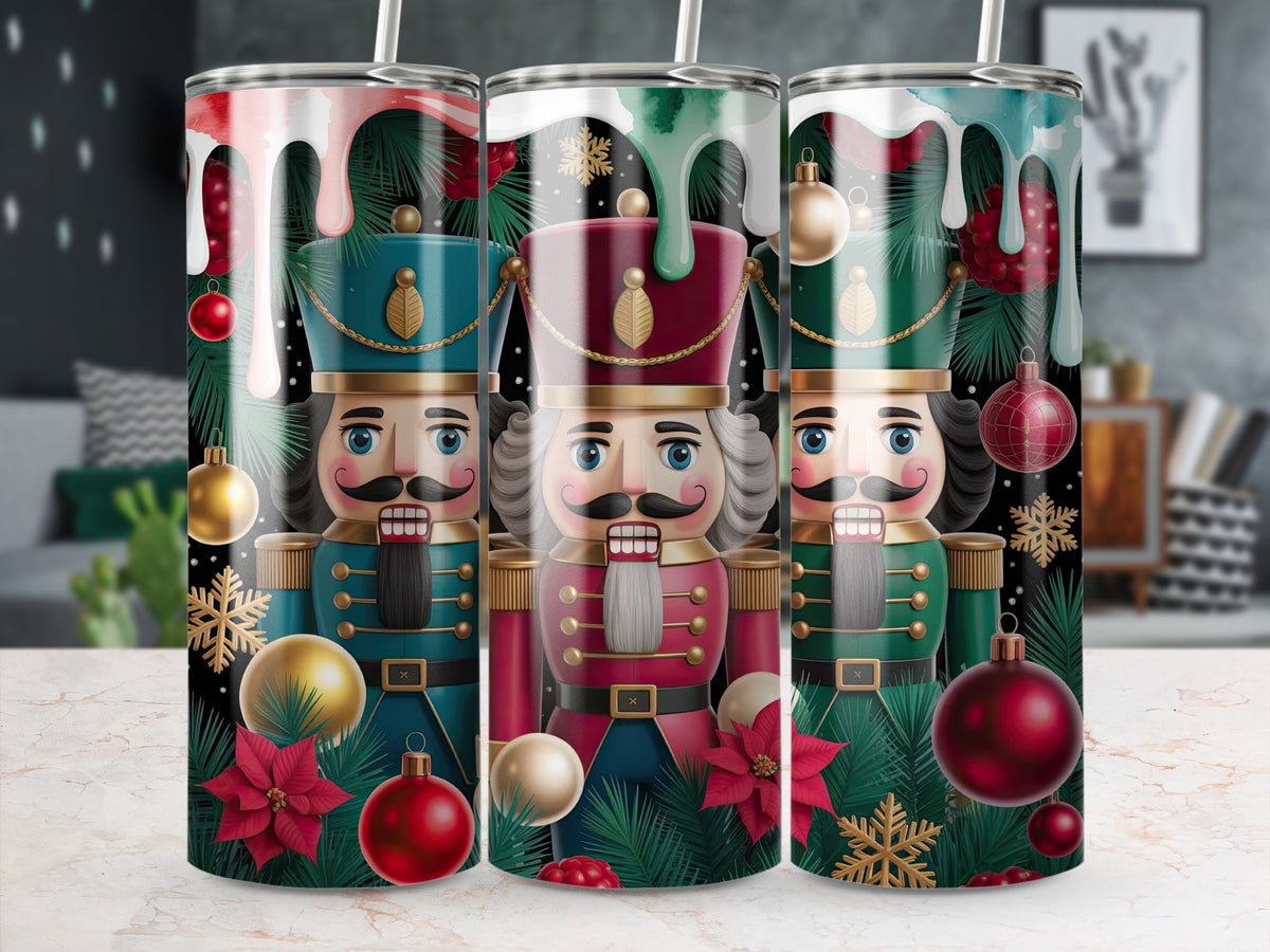 Three metal tumblers with a Christmas nutcracker design, pine branches, ornaments, and dripping icing.