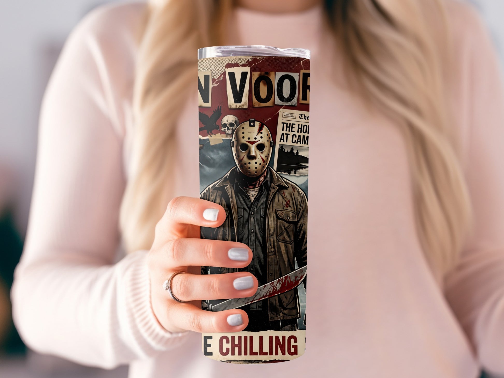 Tumbler with Jason Voorhees artwork, newspaper clippings, skull, and crow.