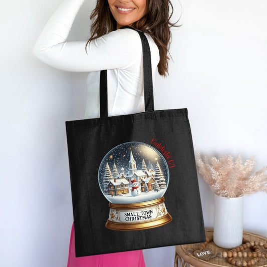 Black tote bag with a snow globe scene and "Valdosta, GA" text.