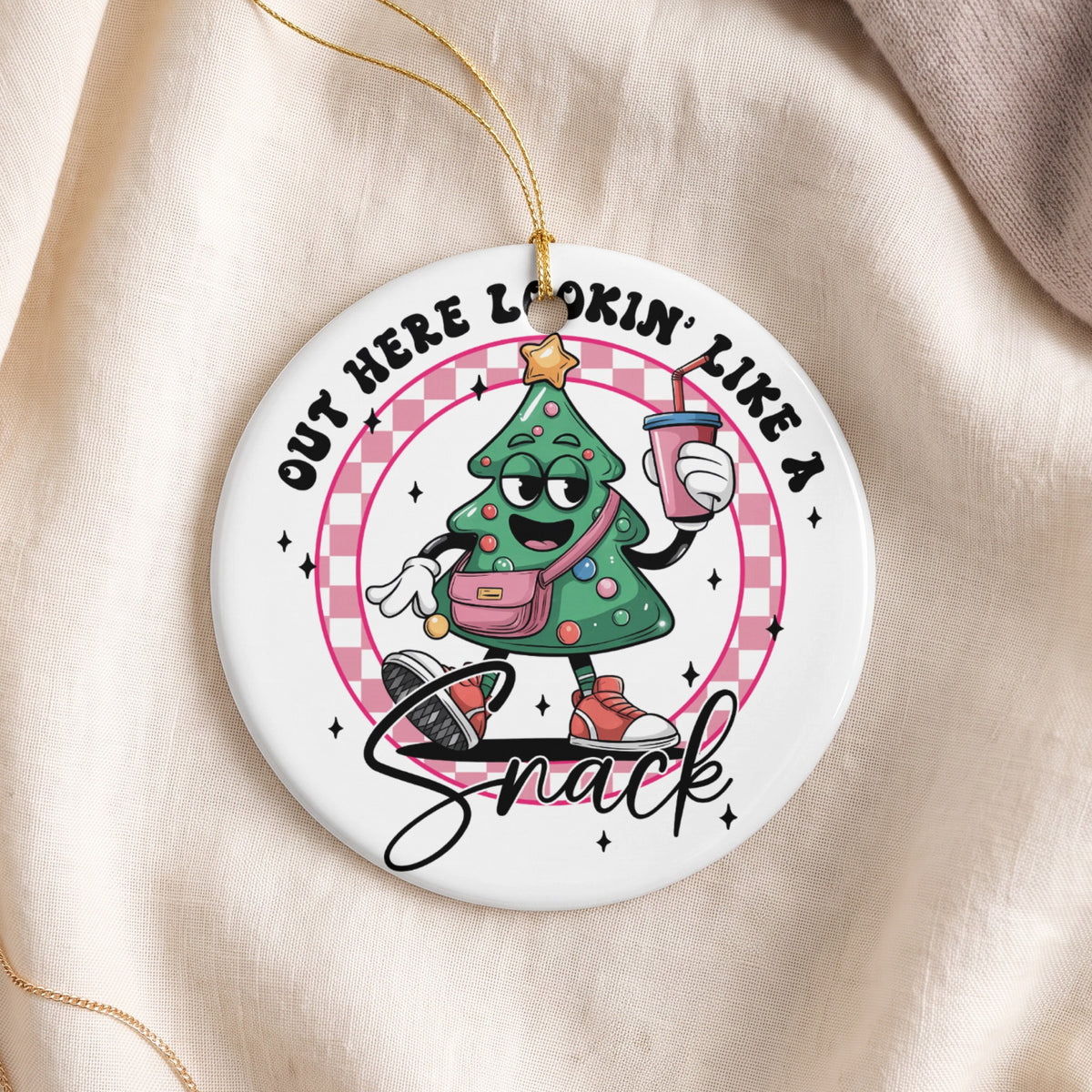 Christmas tree with a pink purse and drink, saying "Out here lookin like a snack".