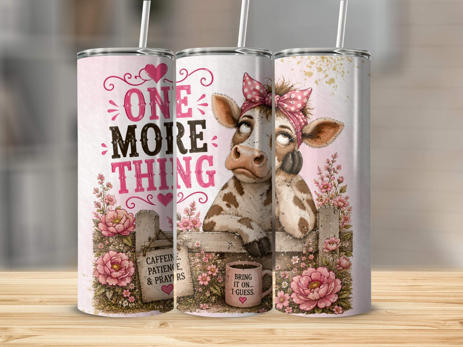 Tumblers with pink floral design and a cow saying "One More Thing".
