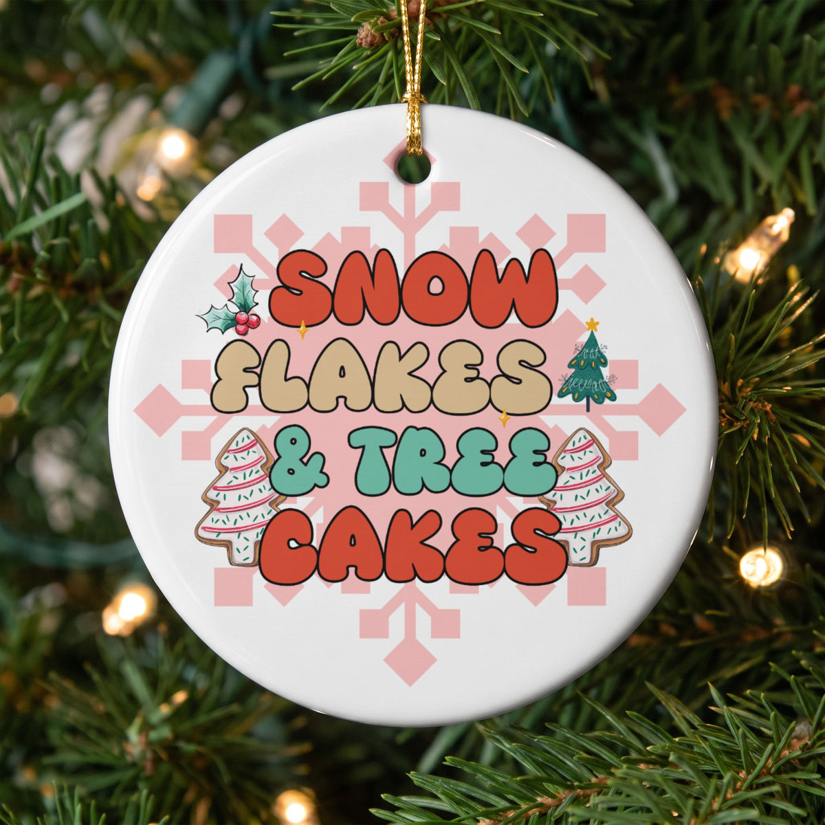Round ornament with text "Snowflakes & Trees Cakes" and festive graphics.