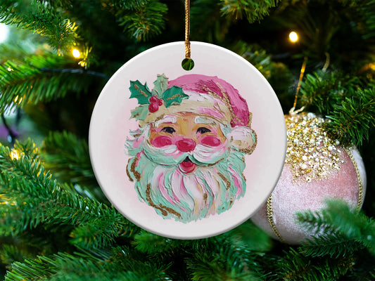 Round ceramic ornament with painted Santa face on a decorated Christmas tree.