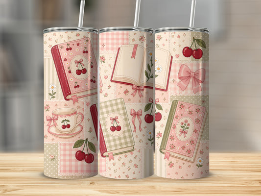 Tumbler with a patchwork design of books, cherries, teacups, and bows.