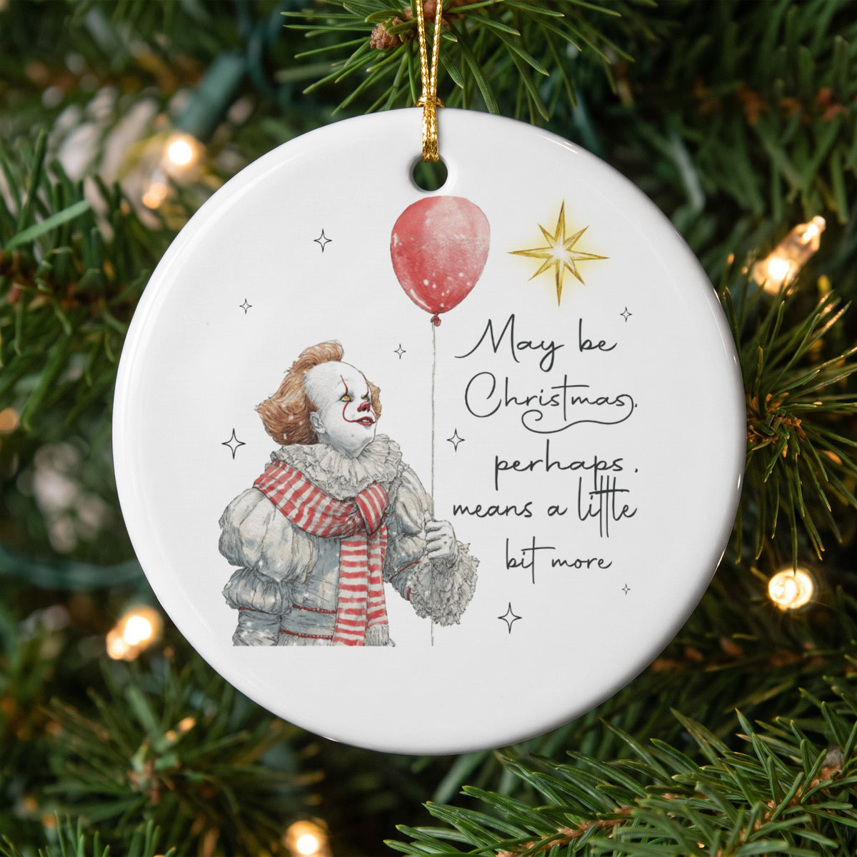 Round ornament with Pennywise the clown, red balloon, and text "May be Christmas, perhaps, means a little bit more."