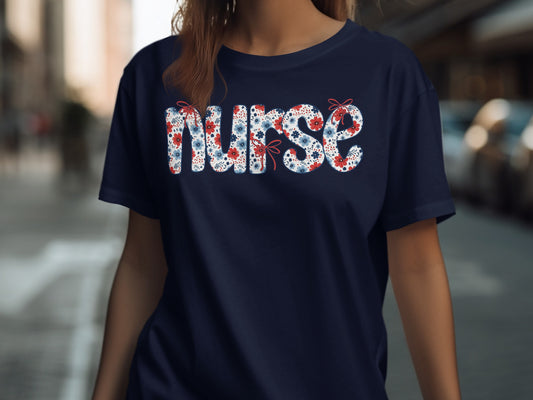 Navy t-shirt with "NURSE" spelled in red and blue floral pattern.