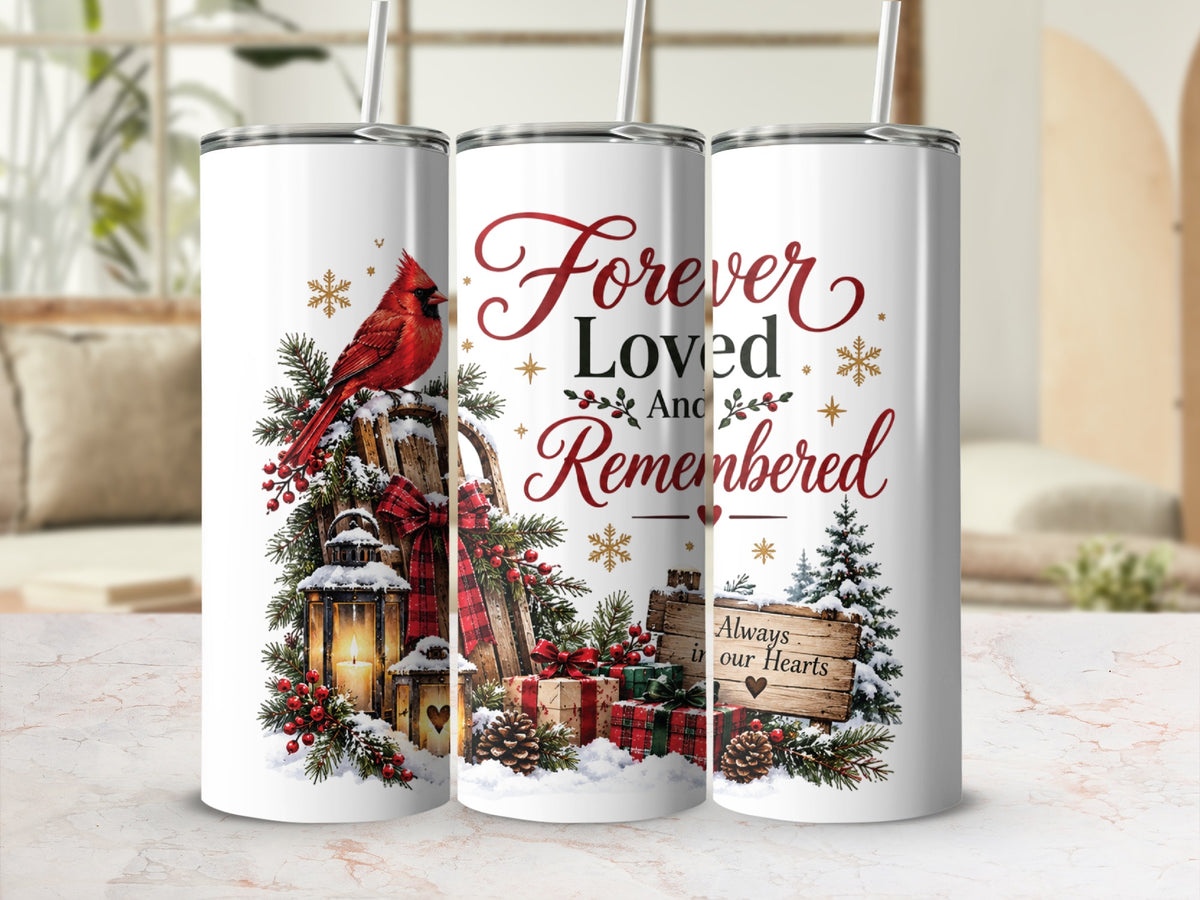 Three white stainless steel tumblers feature a memorial Christmas design with a red cardinal, sled, gifts, and text reading Forever Loved And Remembered.