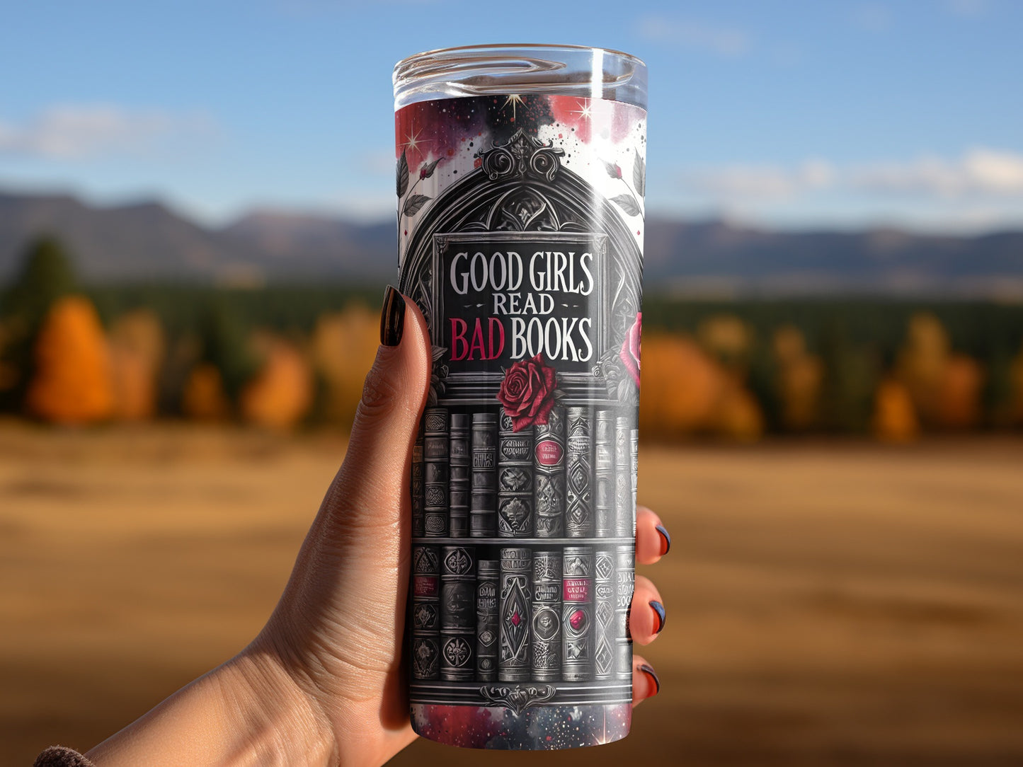 Tumbler with "Good Girls Read Bad Books" text and a bookshelf design.