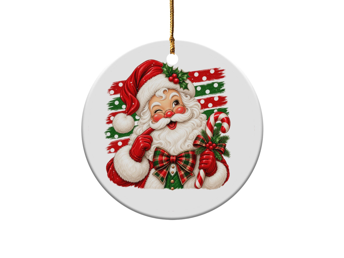 Round Christmas ornament featuring a winking Santa holding a candy cane and holly.