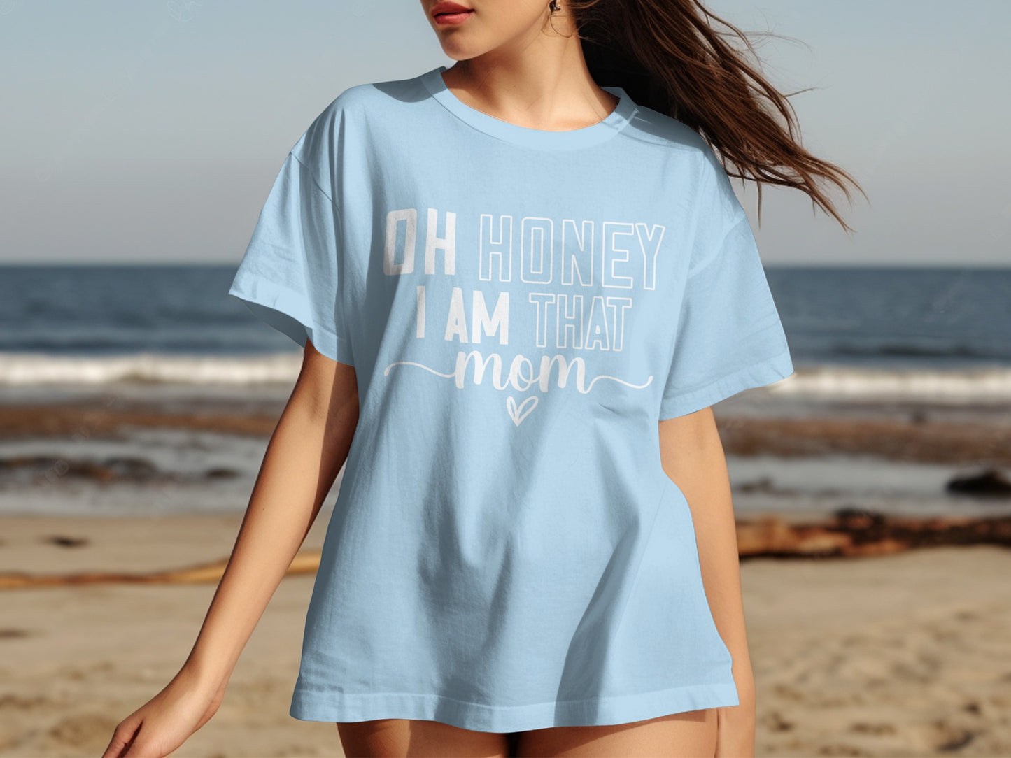 Light blue t-shirt with "OH HONEY I AM THAT MOM" text and heart.