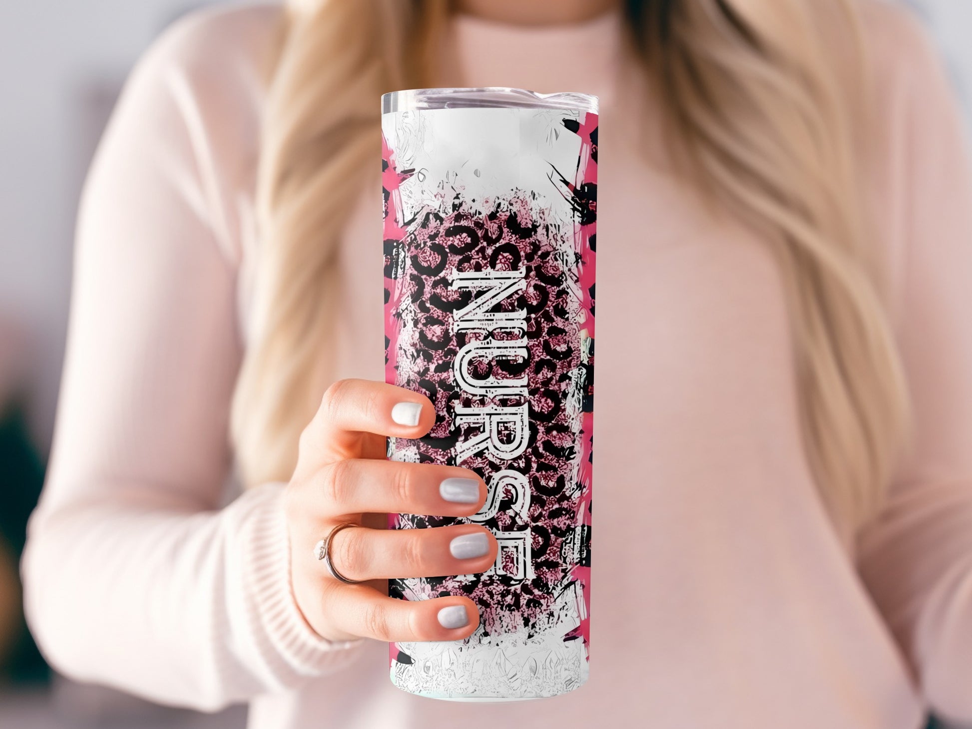 Tumbler with leopard print and "Nurse" text held by a woman.