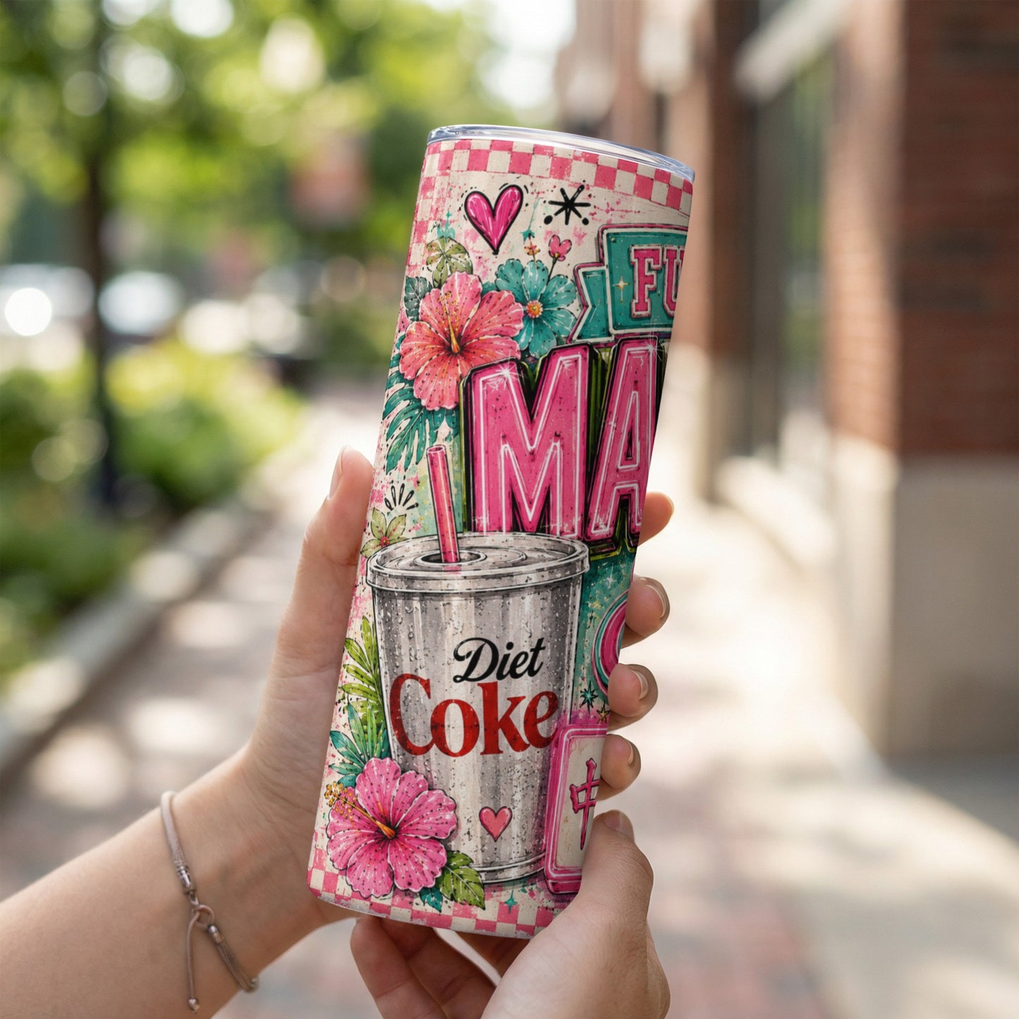 Diet Coke tumbler with hibiscus flowers and "Fuma" text.