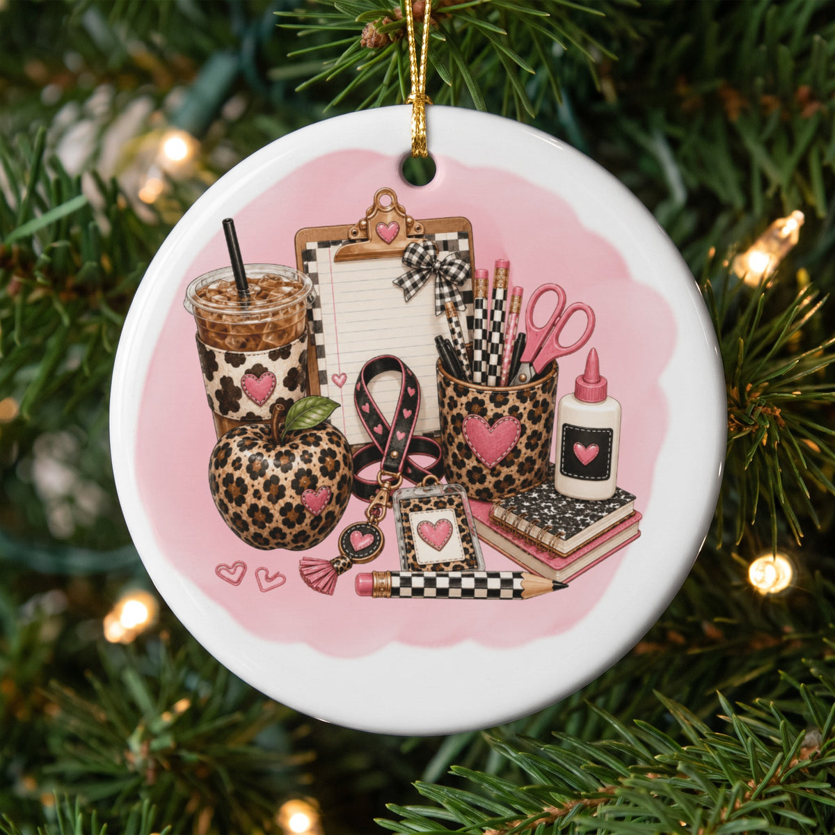 Ornament with leopard print teacher supplies and pink hearts.