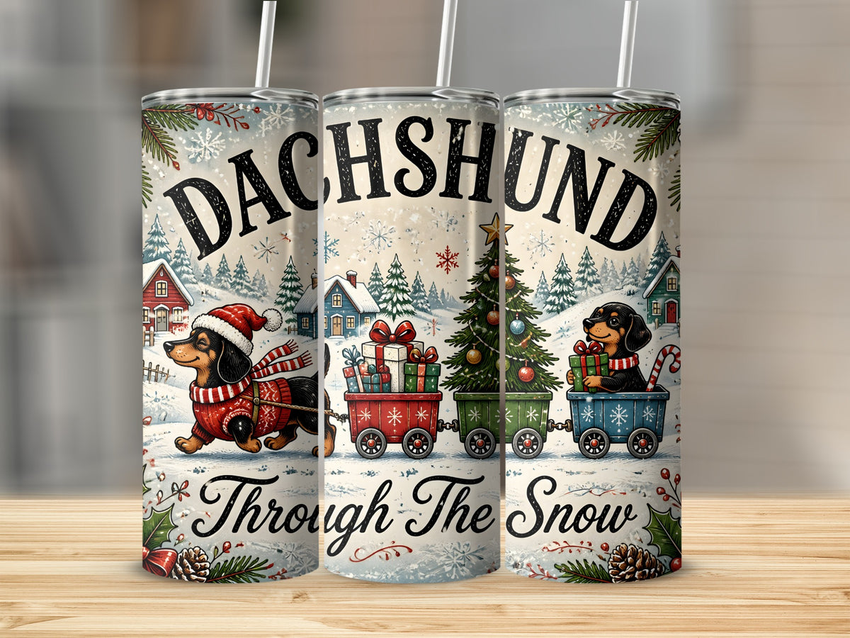 Three stainless steel tumblers feature a watercolor dachshund holiday design with text reading Dachshund Through the Snow.