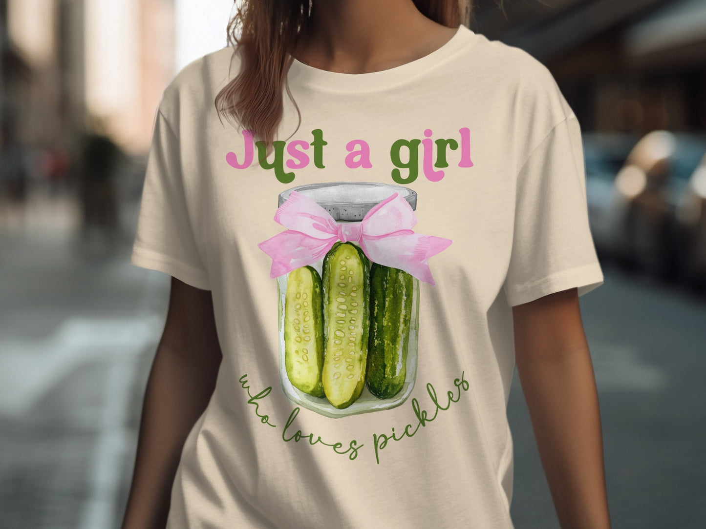 Cream t-shirt with "Just a girl who loves pickles" text and jar of pickles design.