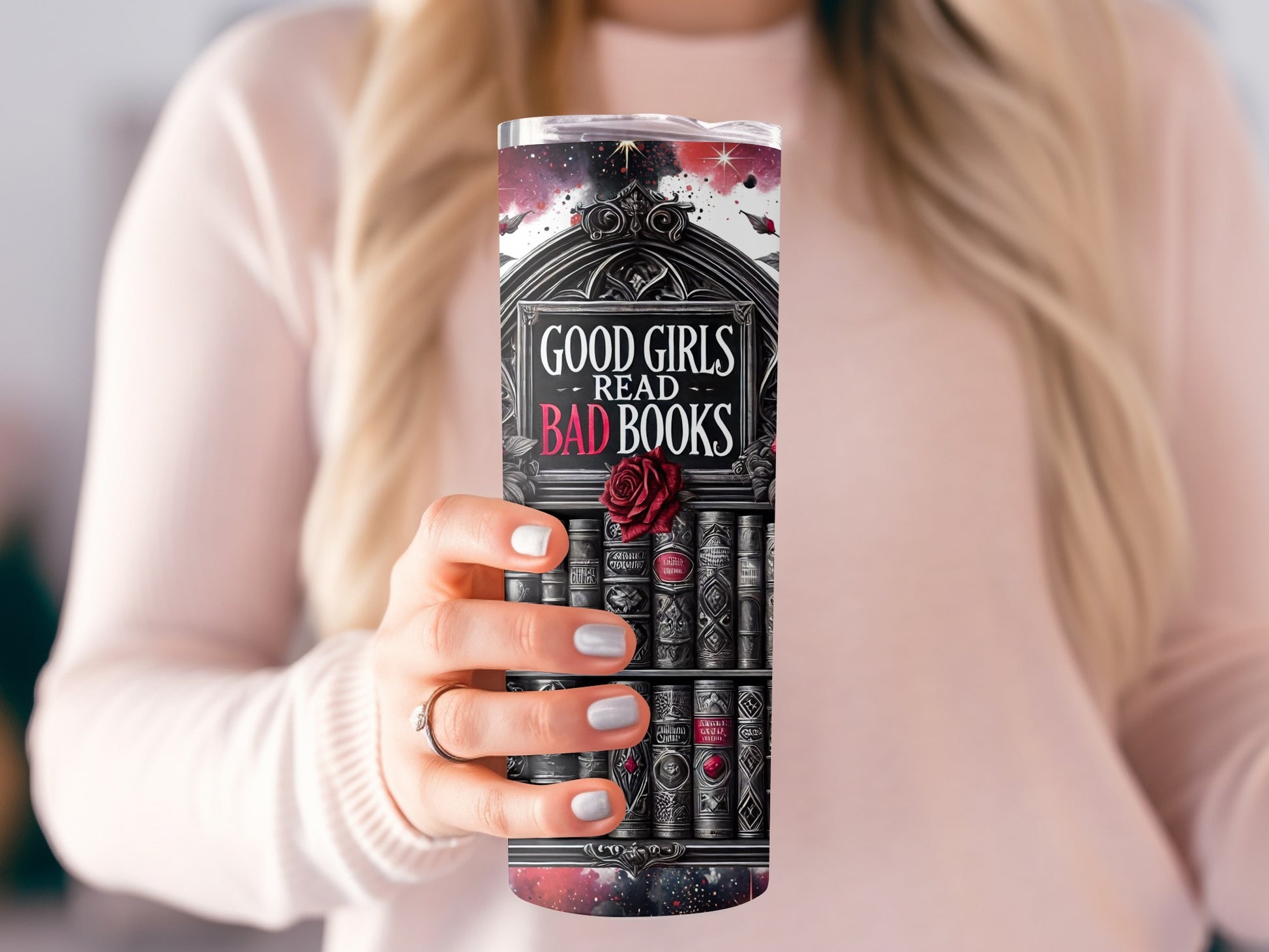 Tumbler with "GOOD GIRLS READ BAD BOOKS" text and ornate bookshelf design.