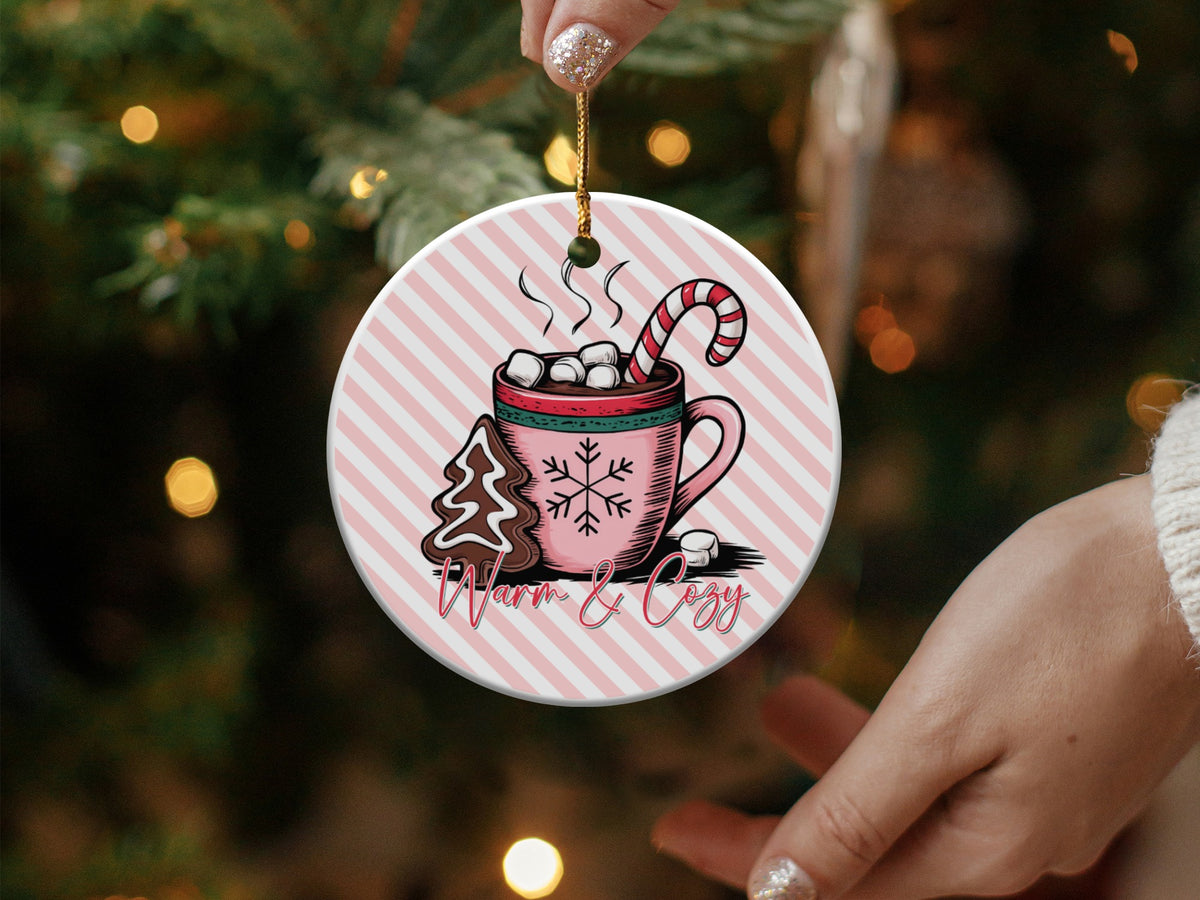 Christmas ornament with hot cocoa, candy cane, gingerbread, and "Warm & Cozy" text.