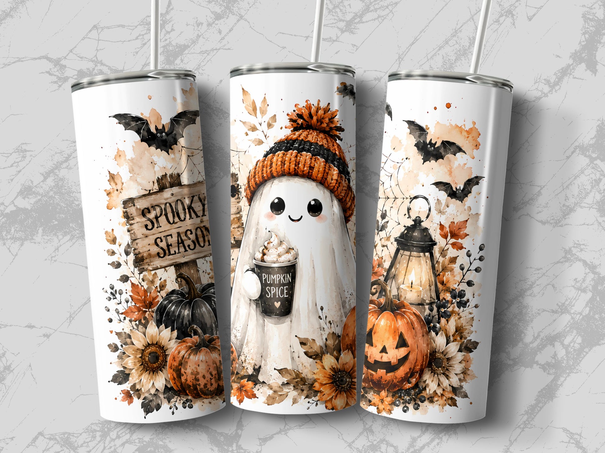Three Halloween tumblers with ghost, pumpkins, bats, and fall leaves.