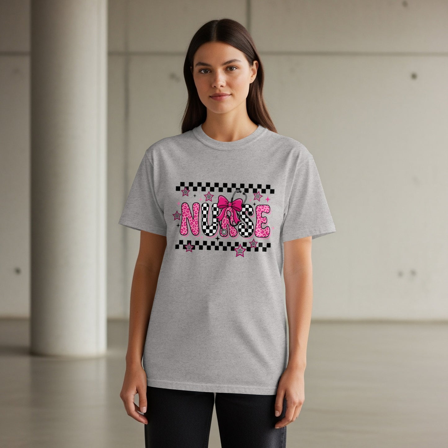 Grey t-shirt with "NURSE" in pink lettering and black and white checkerboard design.
