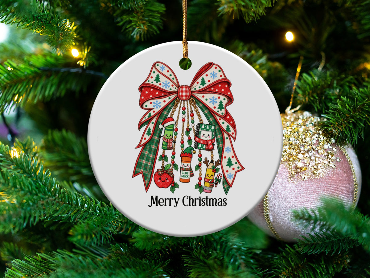 Merry Christmas ornament with school supplies and a bow on a tree.