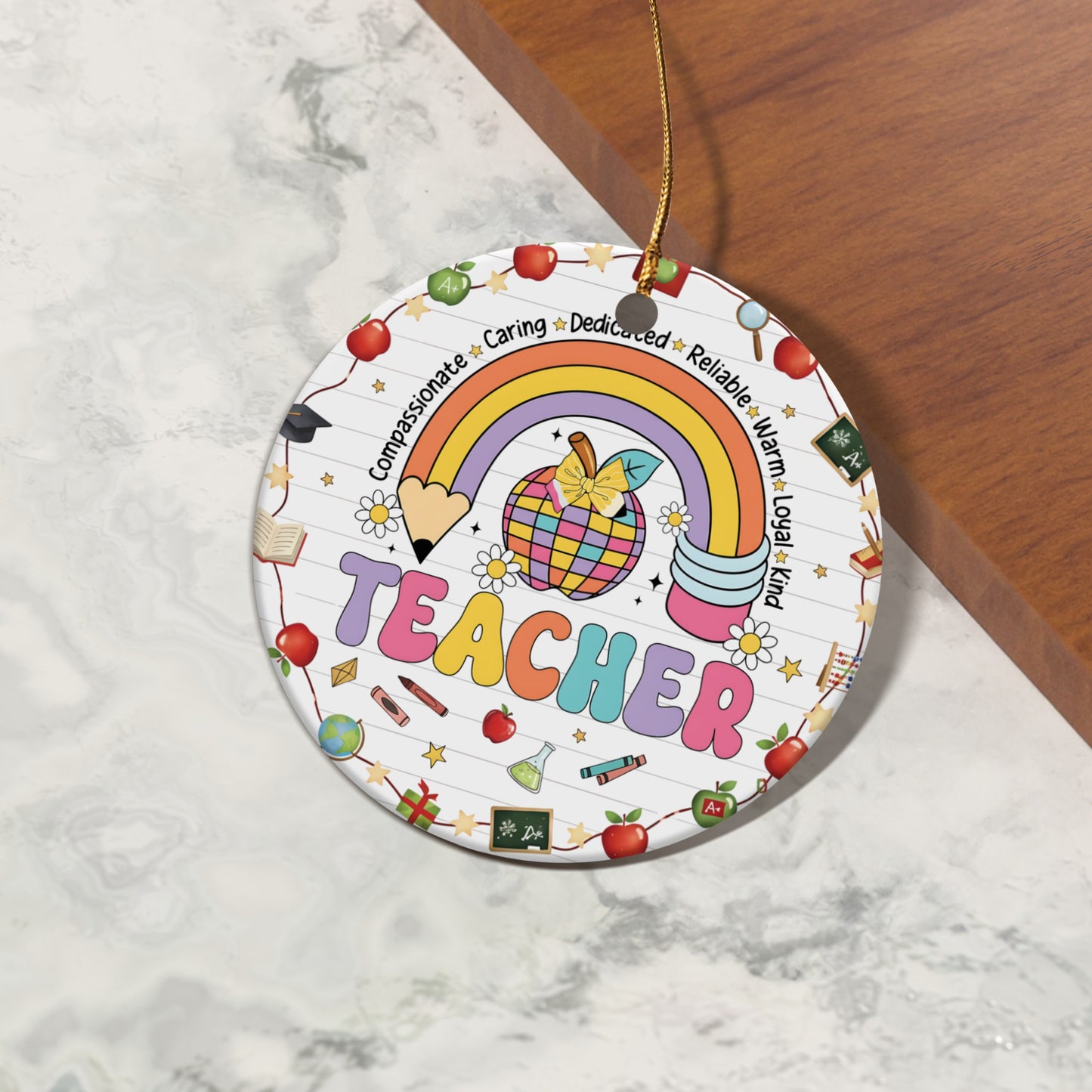 Round ornament with "TEACHER" text, rainbow, apple, and school-themed icons.