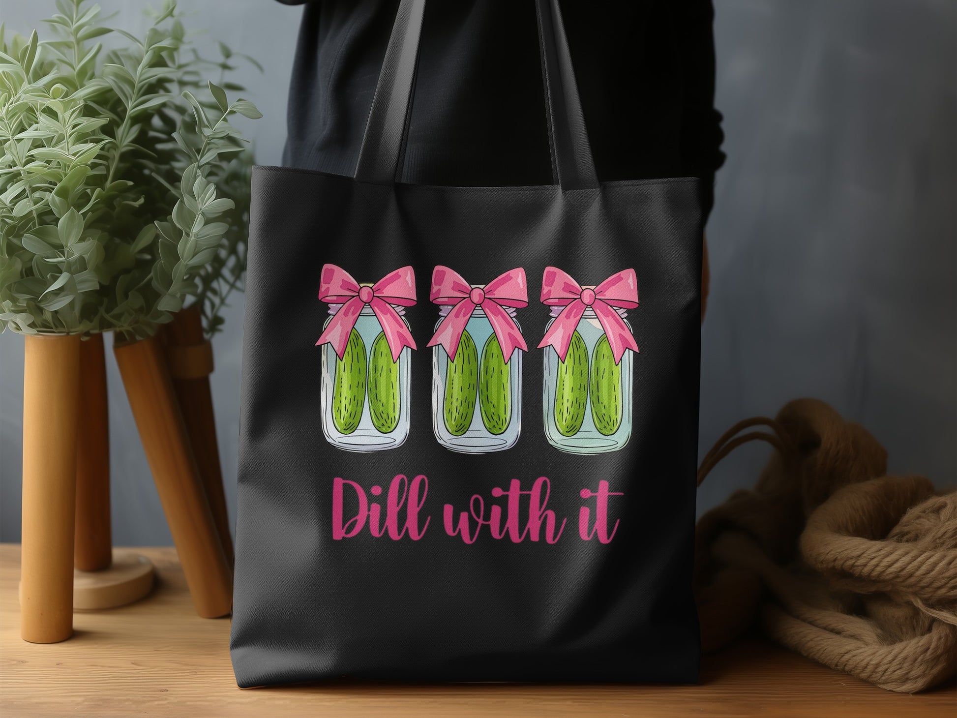 Three jars of pickles with pink bows and "Dill with it" text.