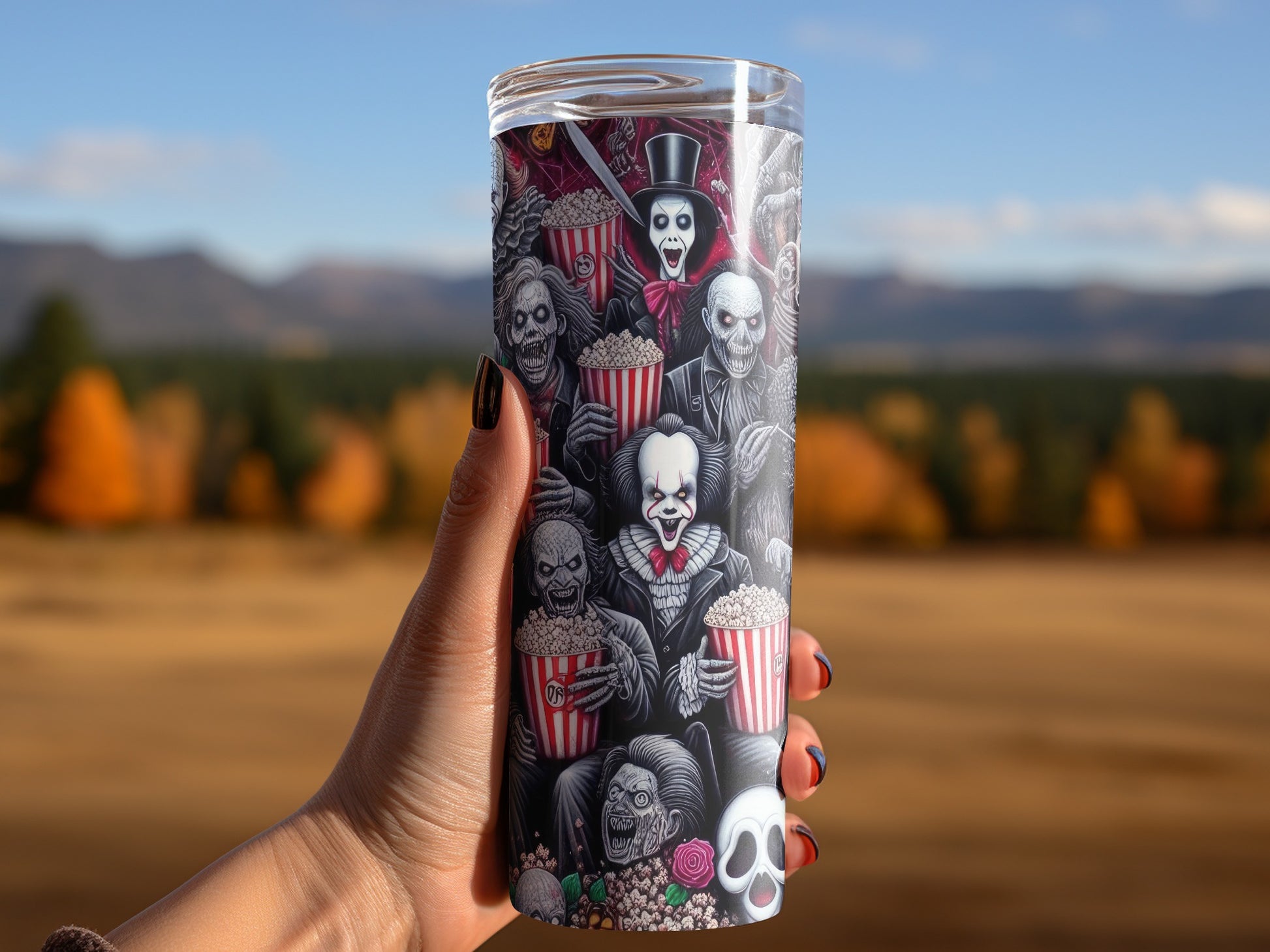 Tumbler featuring various horror movie characters and popcorn buckets.