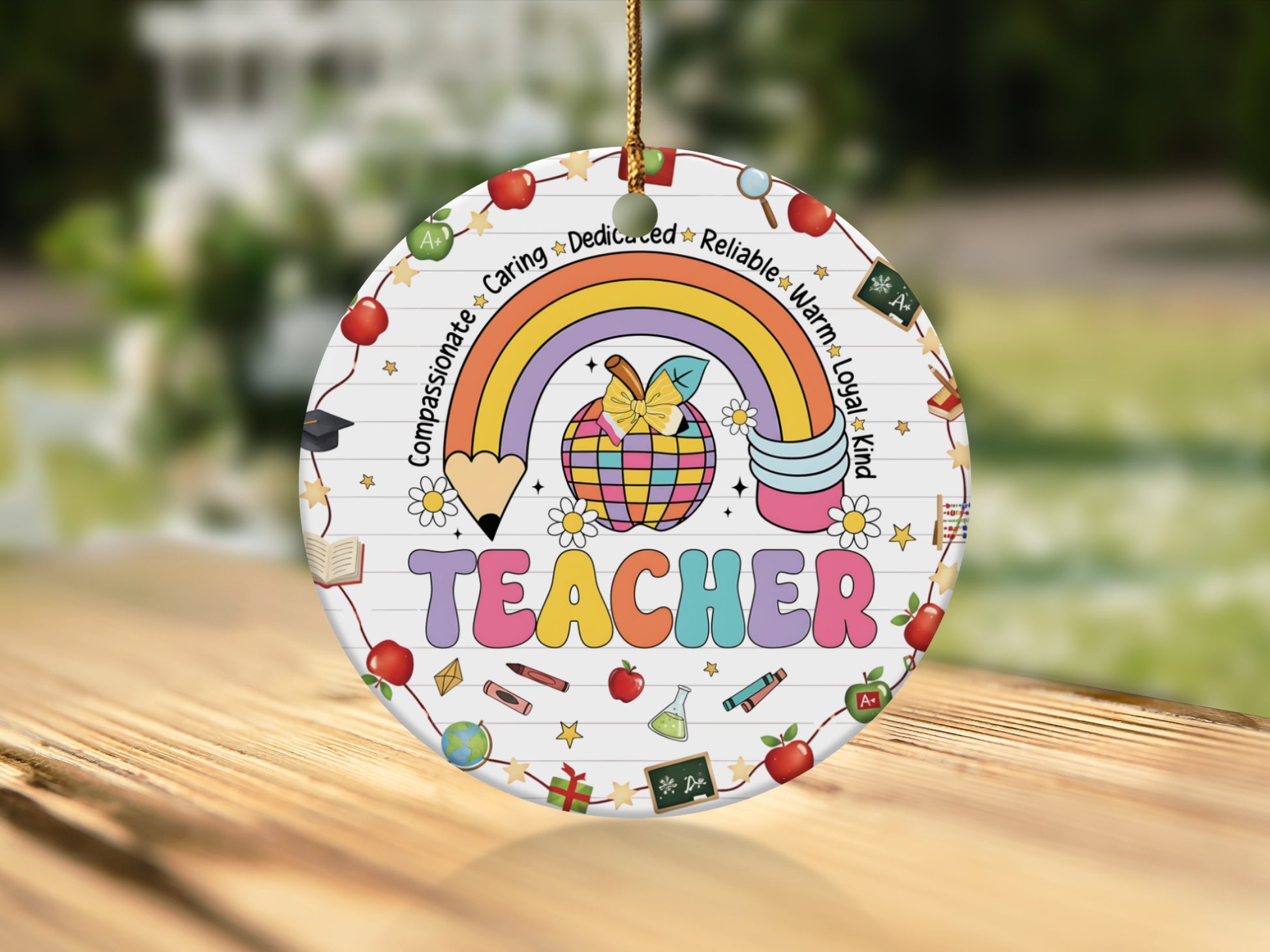 Round ornament with "TEACHER" in colorful letters and school-themed icons.