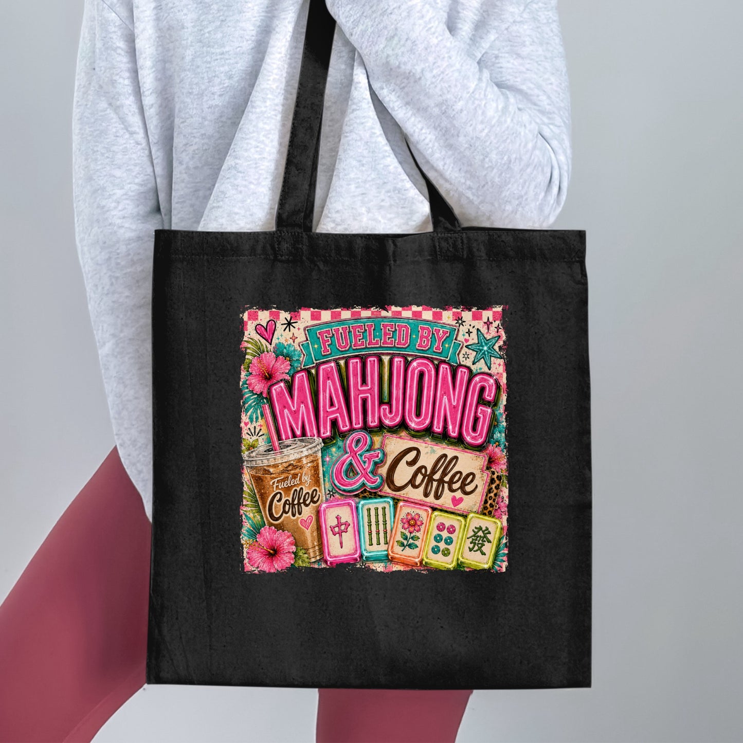 Black tote bag with a graphic reading "Fueled by Mahjong & Coffee".