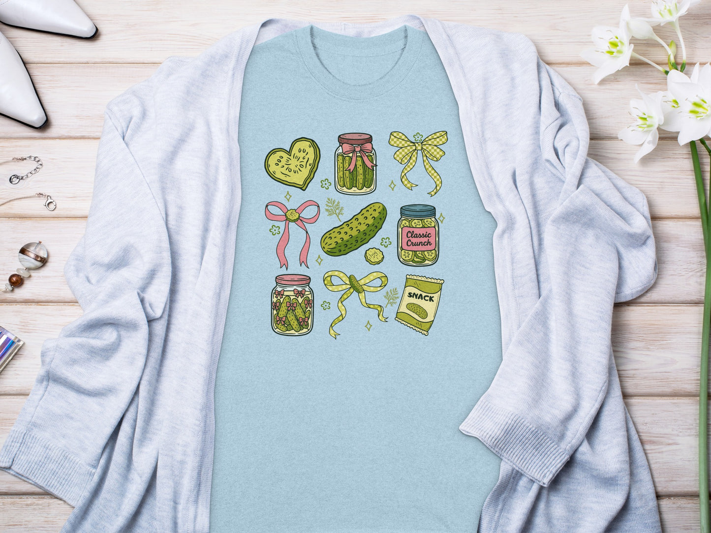 Light blue t-shirt featuring dill pickle designs and text.