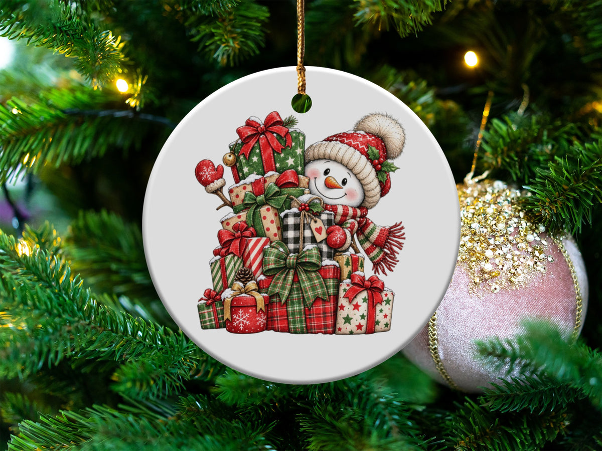 Christmas ornament featuring a smiling snowman surrounded by presents on a decorated tree.