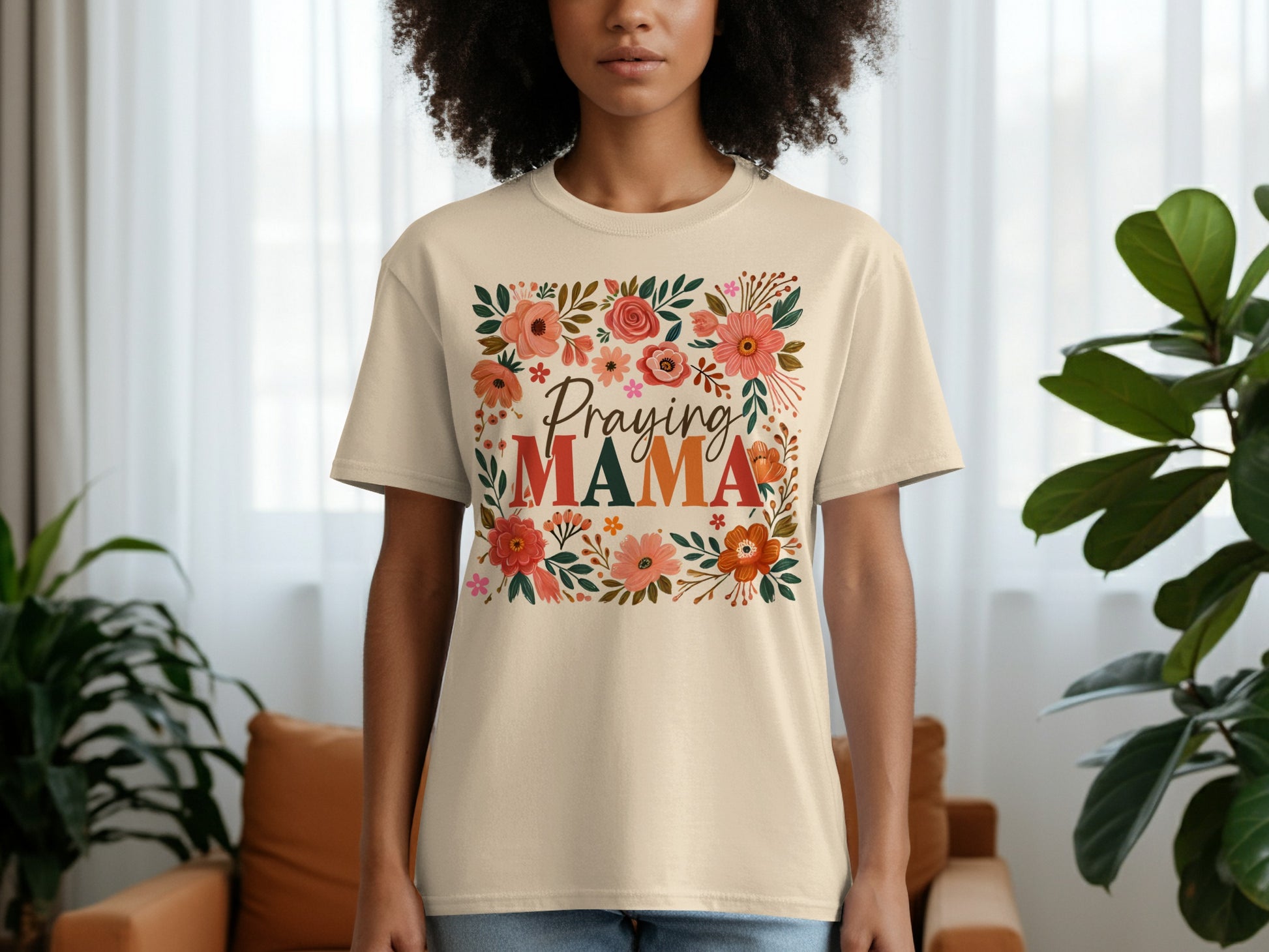 Beige t-shirt with "Praying Mama" floral text design.