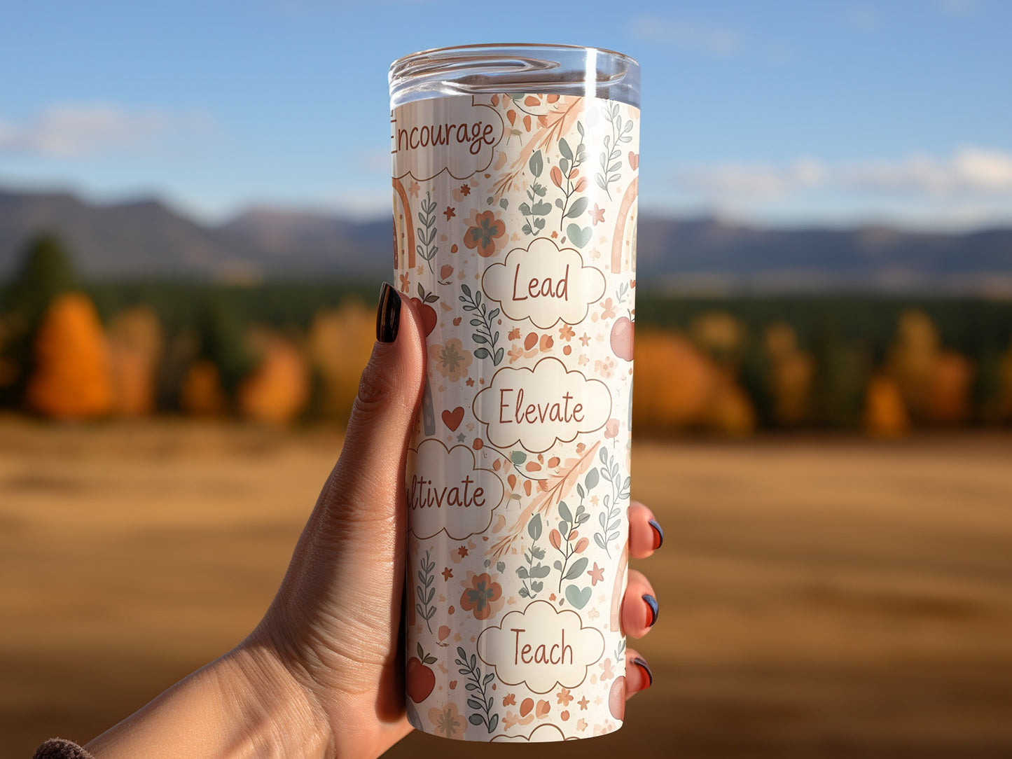 Tumbler with floral pattern and words Encourage, Lead, Elevate, Cultivate, Teach.