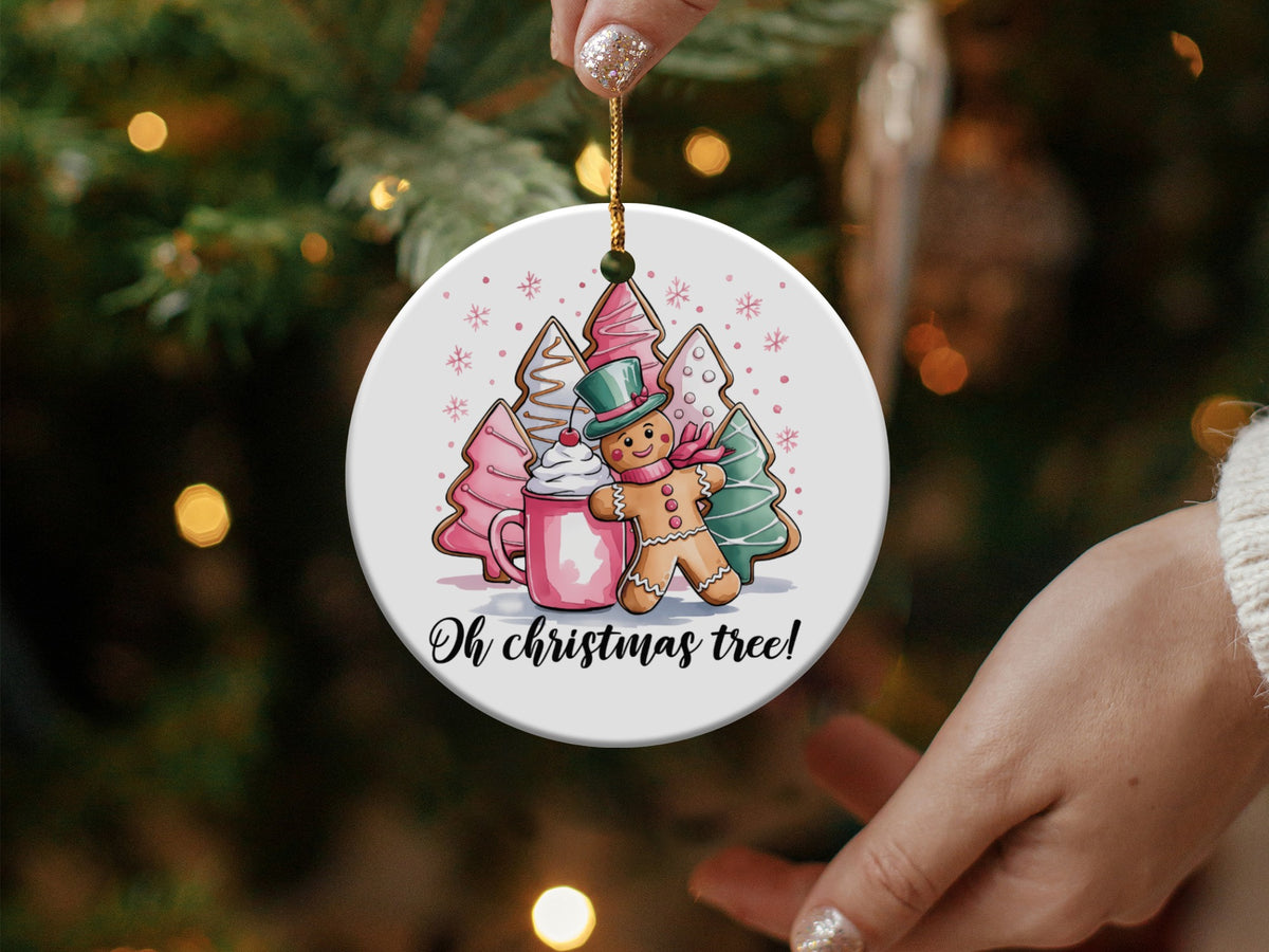 Christmas ornament featuring a gingerbread man, mug, and trees with "Oh christmas tree!" text.