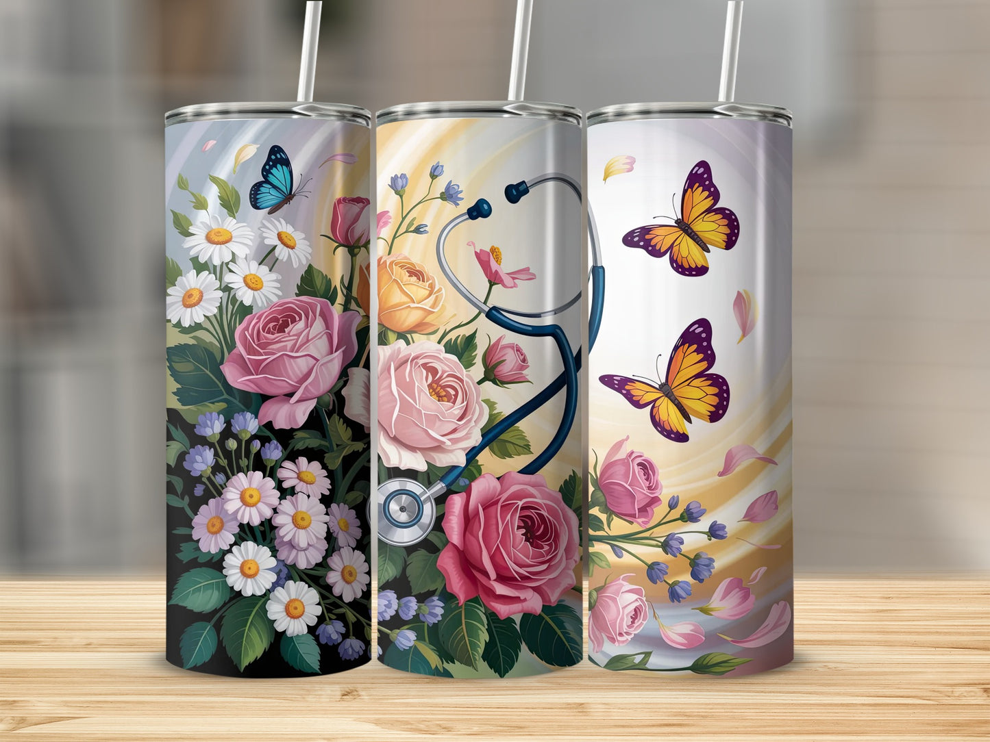 Three stainless steel tumblers with floral and butterfly designs.