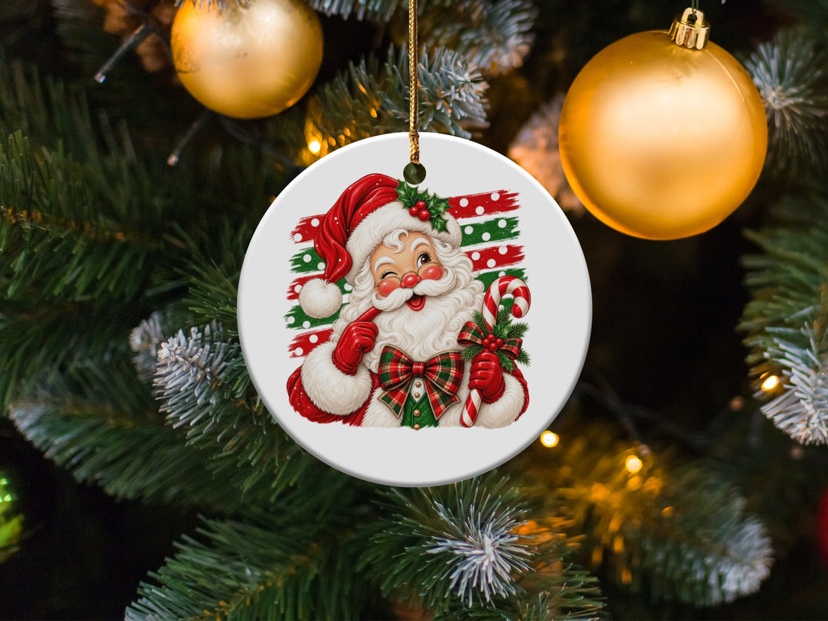 Round ornament with a cheerful Santa Claus holding a candy cane and surrounded by Christmas tree branches.