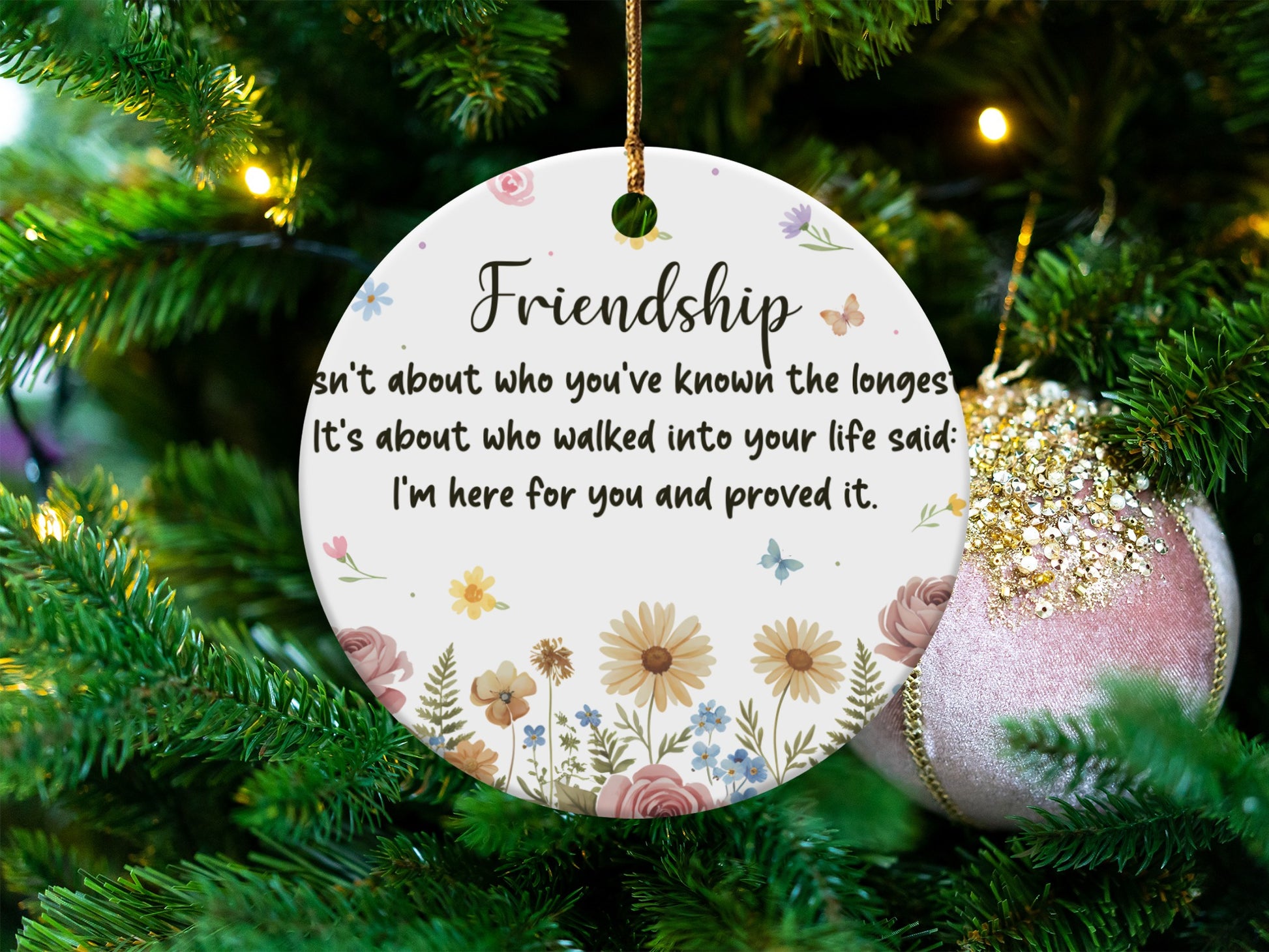 Friendship ornament with floral design and quote about proving presence.