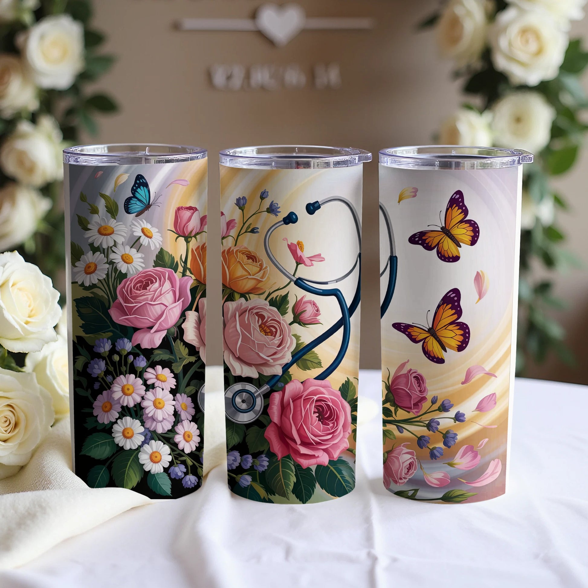 Three floral tumblers with butterflies and stethoscope designs.