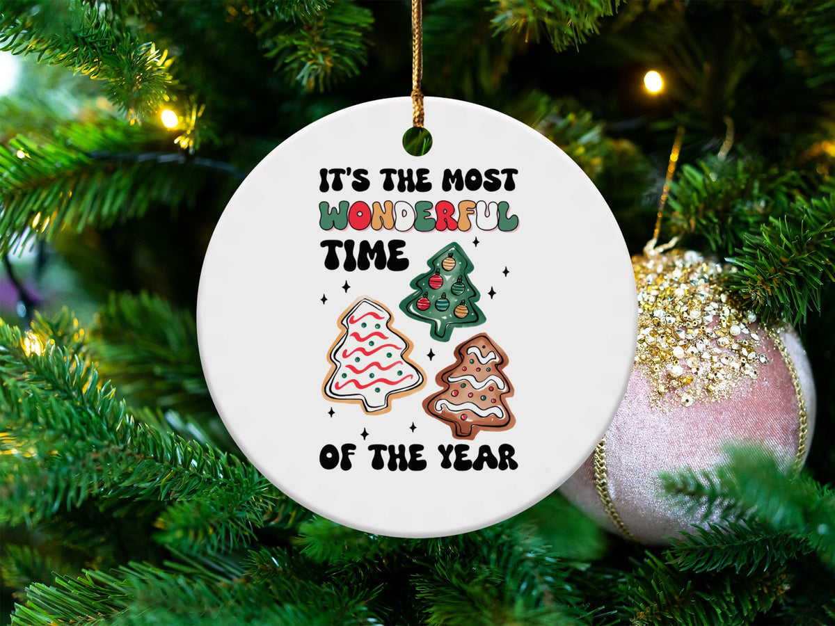 Round ornament with "It's the most wonderful time of the year" and Christmas trees.