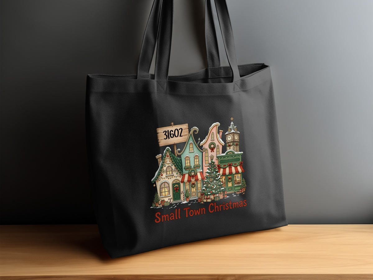 Black tote bag with "Small Town Christmas" and holiday village artwork.
