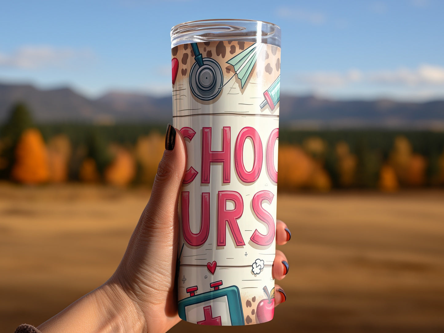 Tumbler with "SCHOOL NURSES" text and medical icons held by a hand.