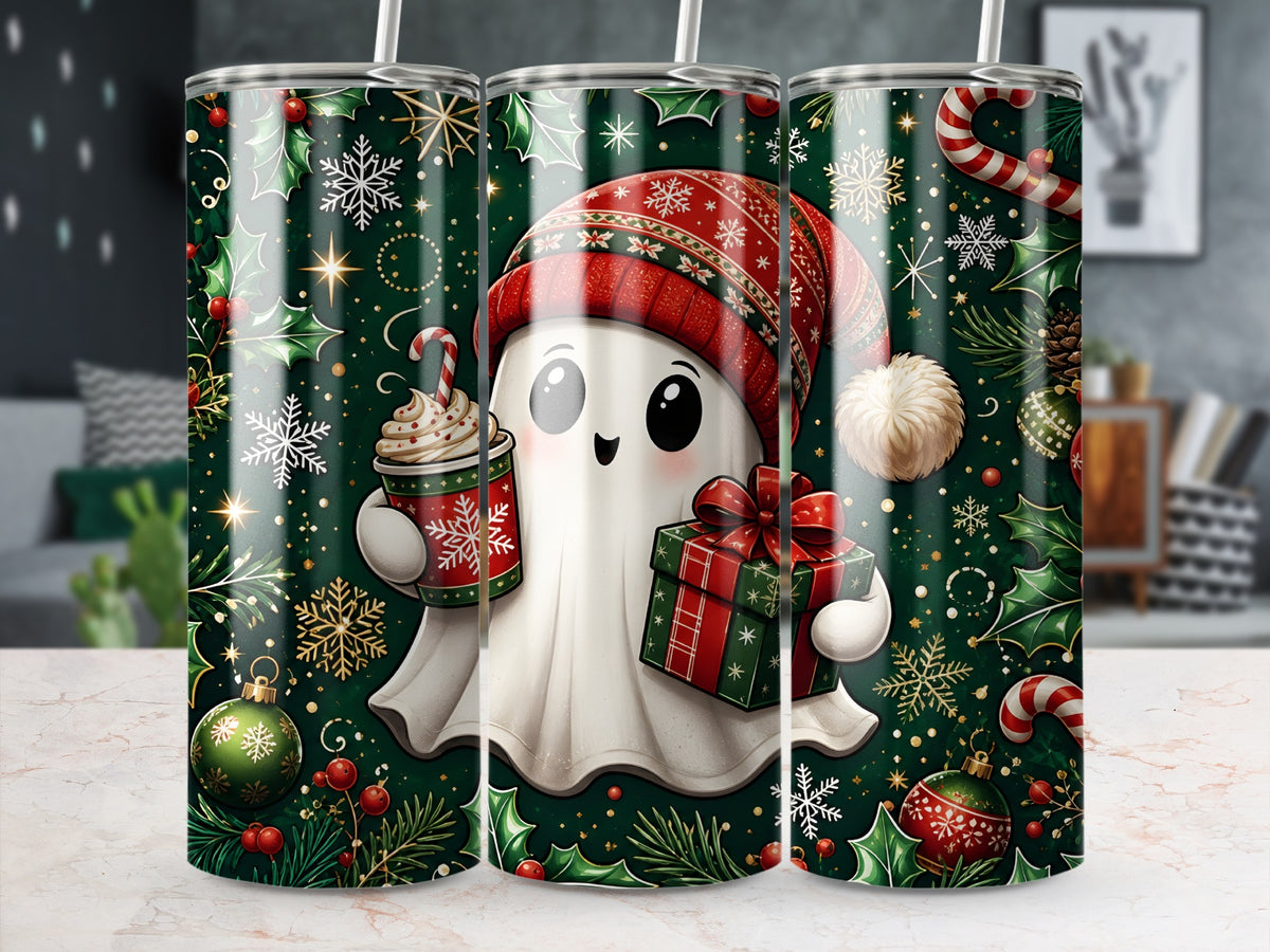 Three identical stainless steel tumblers stand on a counter, featuring a festive green pattern with a cute Christmas ghost holding a gift and hot cocoa.