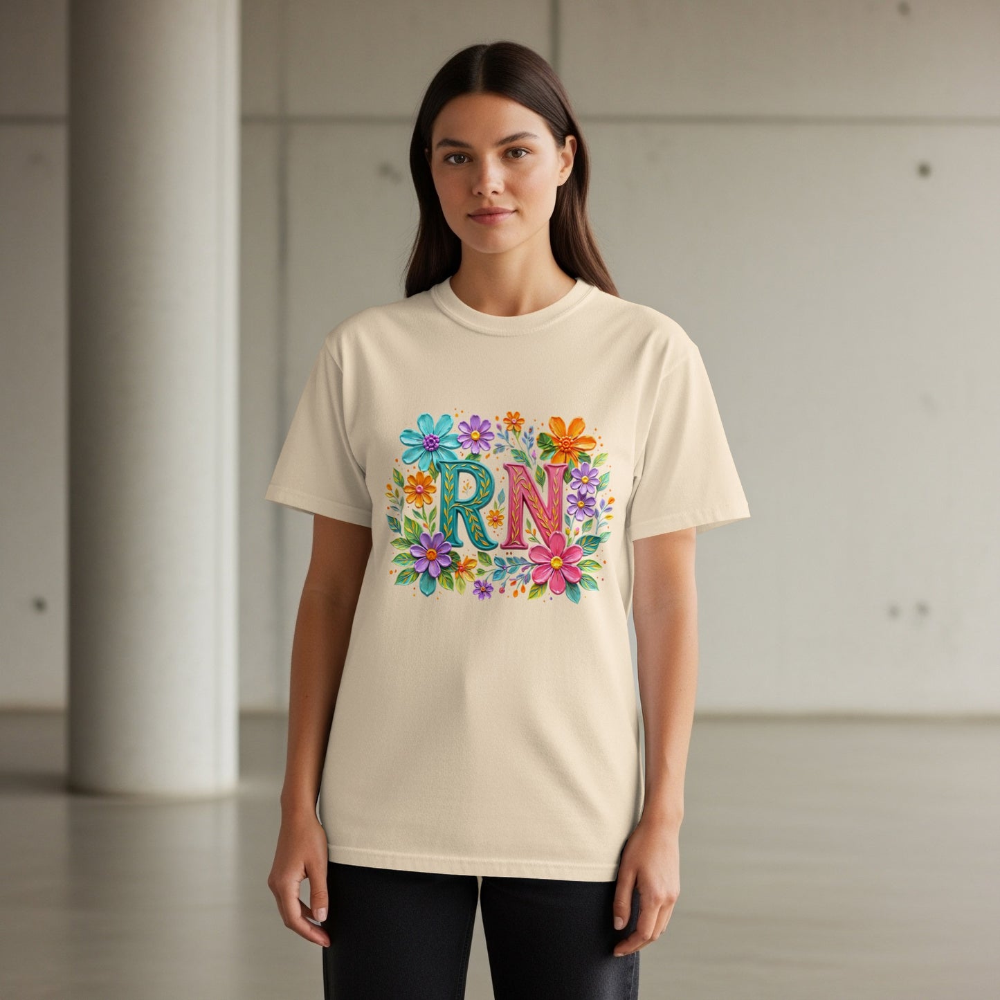 Light yellow t-shirt with colorful floral "RN" design.