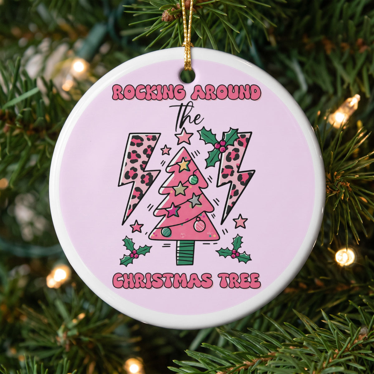 Ornament with pink background, Christmas tree, lightning bolts, and text "Rocking Around The Christmas Tree".