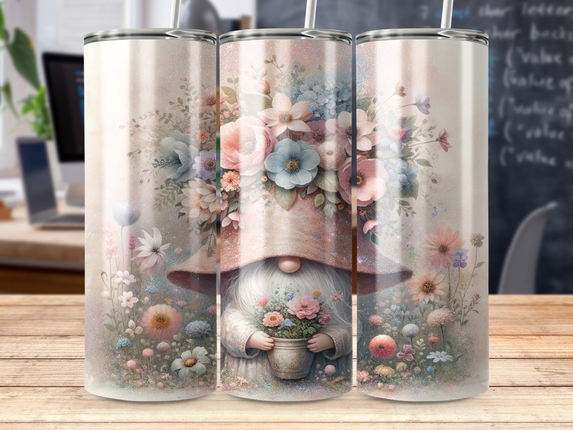 Gnome holding flowers with floral and glitter design on a tumbler.