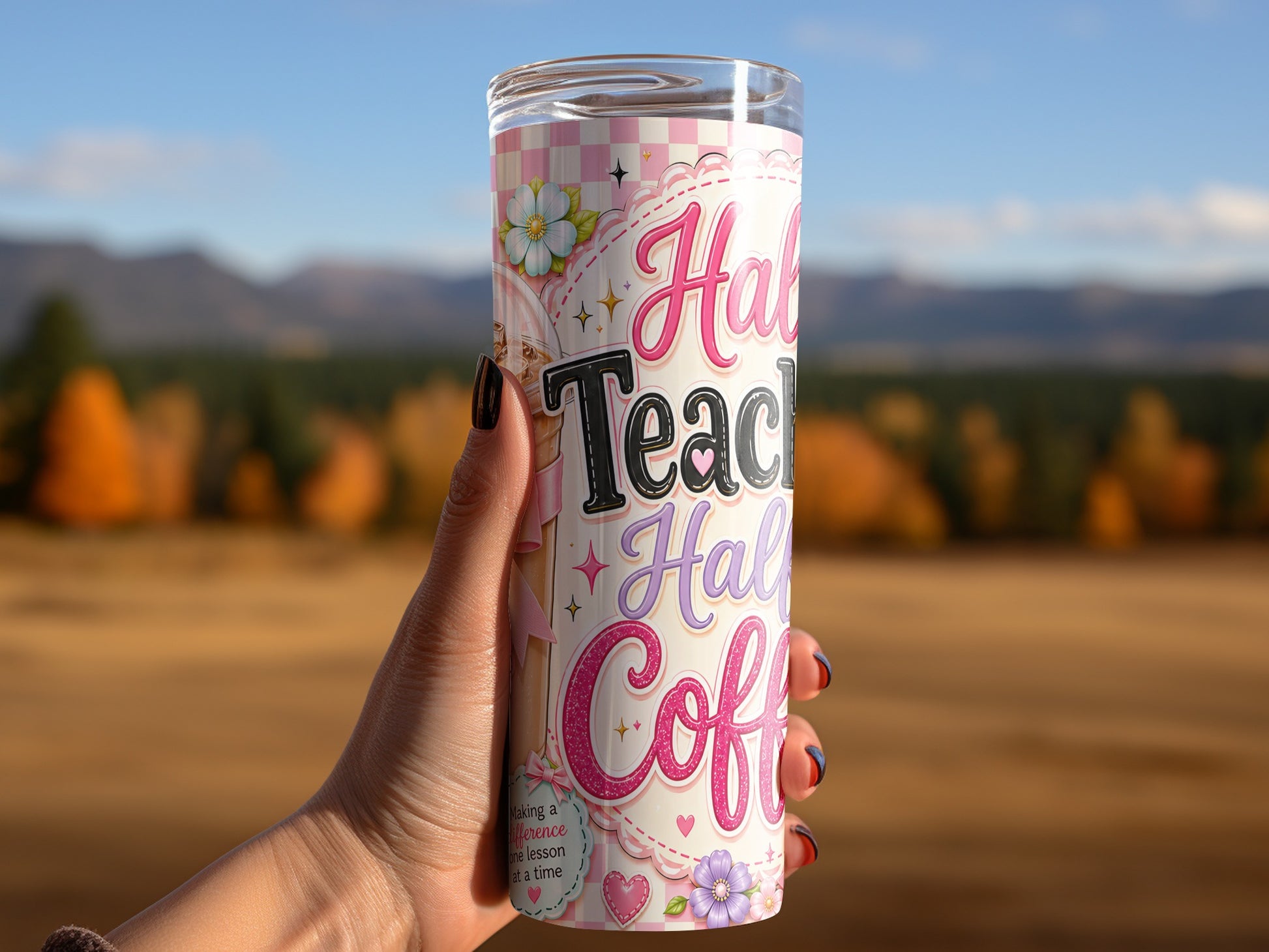 Tumbler with "Half Teacher, Half Coffee" text and floral design, held by a hand.